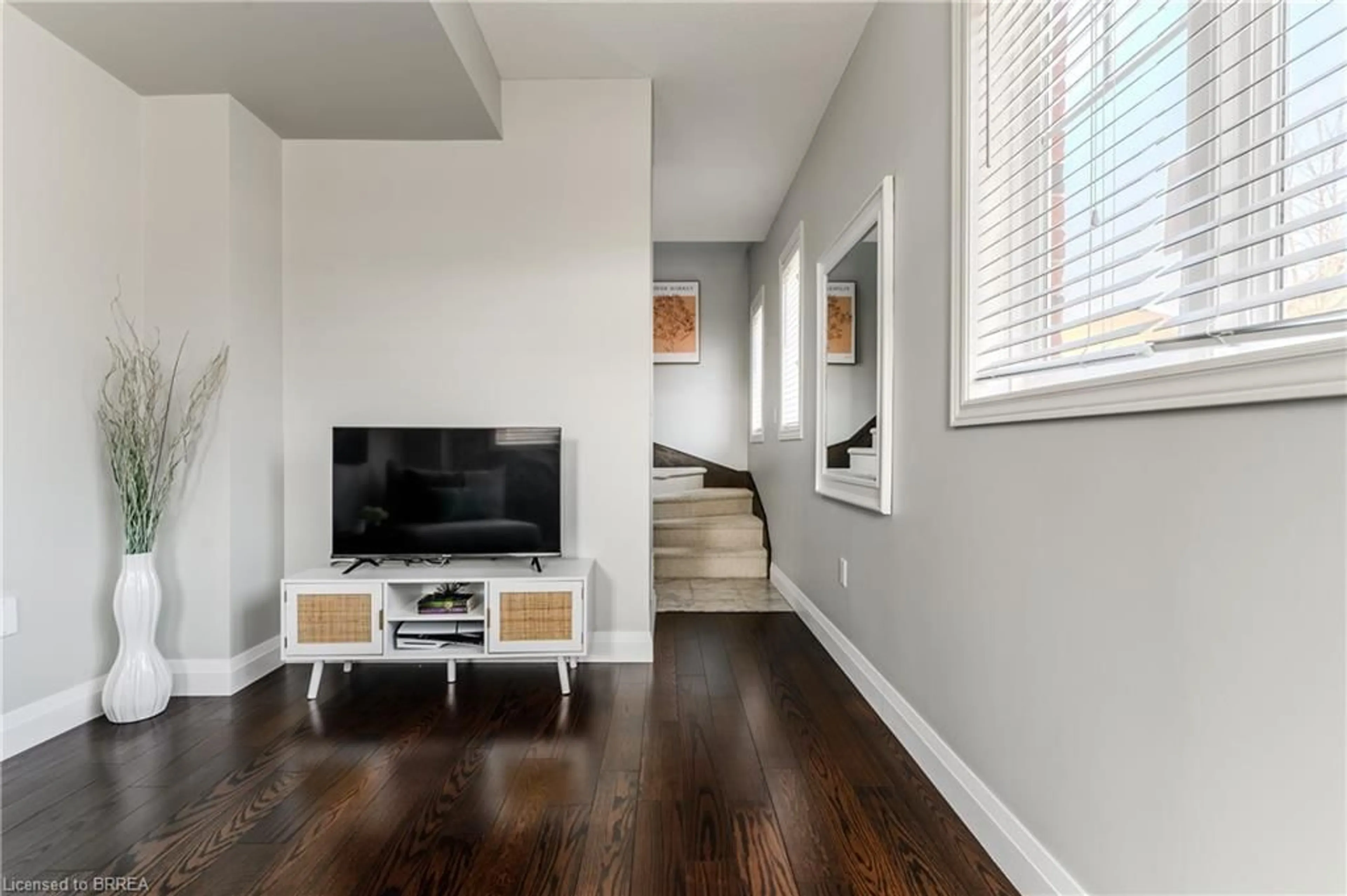 Living room with furniture, wood/laminate floor for 310 Fall Fair Way #34, Binbrook Ontario L0R 1C0