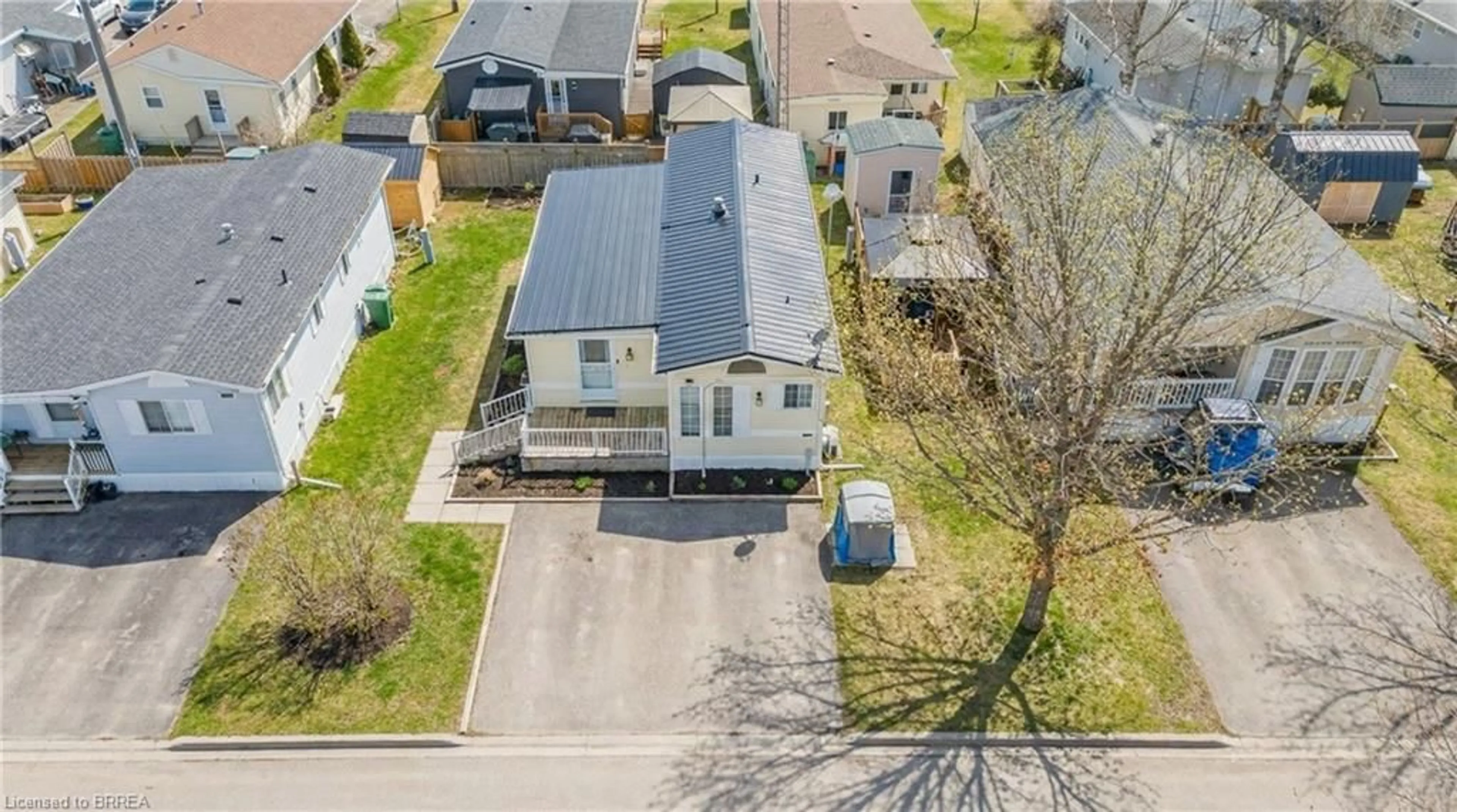 A pic from outside/outdoor area/front of a property/back of a property/a pic from drone, street for 428 Pine Pass, Wellington Ontario N1M 2W5