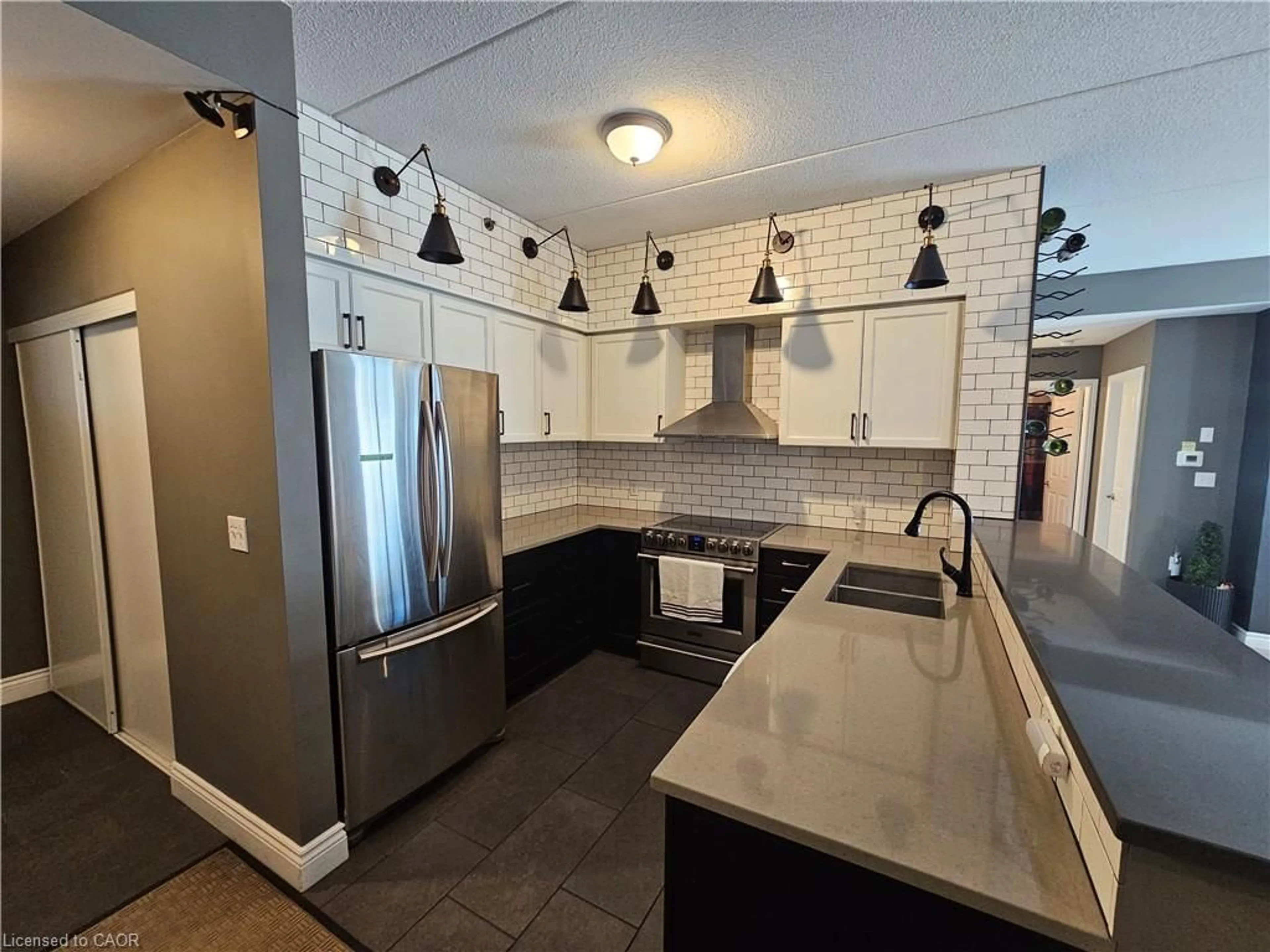 Open concept kitchen, ceramic/tile floor for 308 Watson Pky #102, Guelph Ontario N1E 0G7