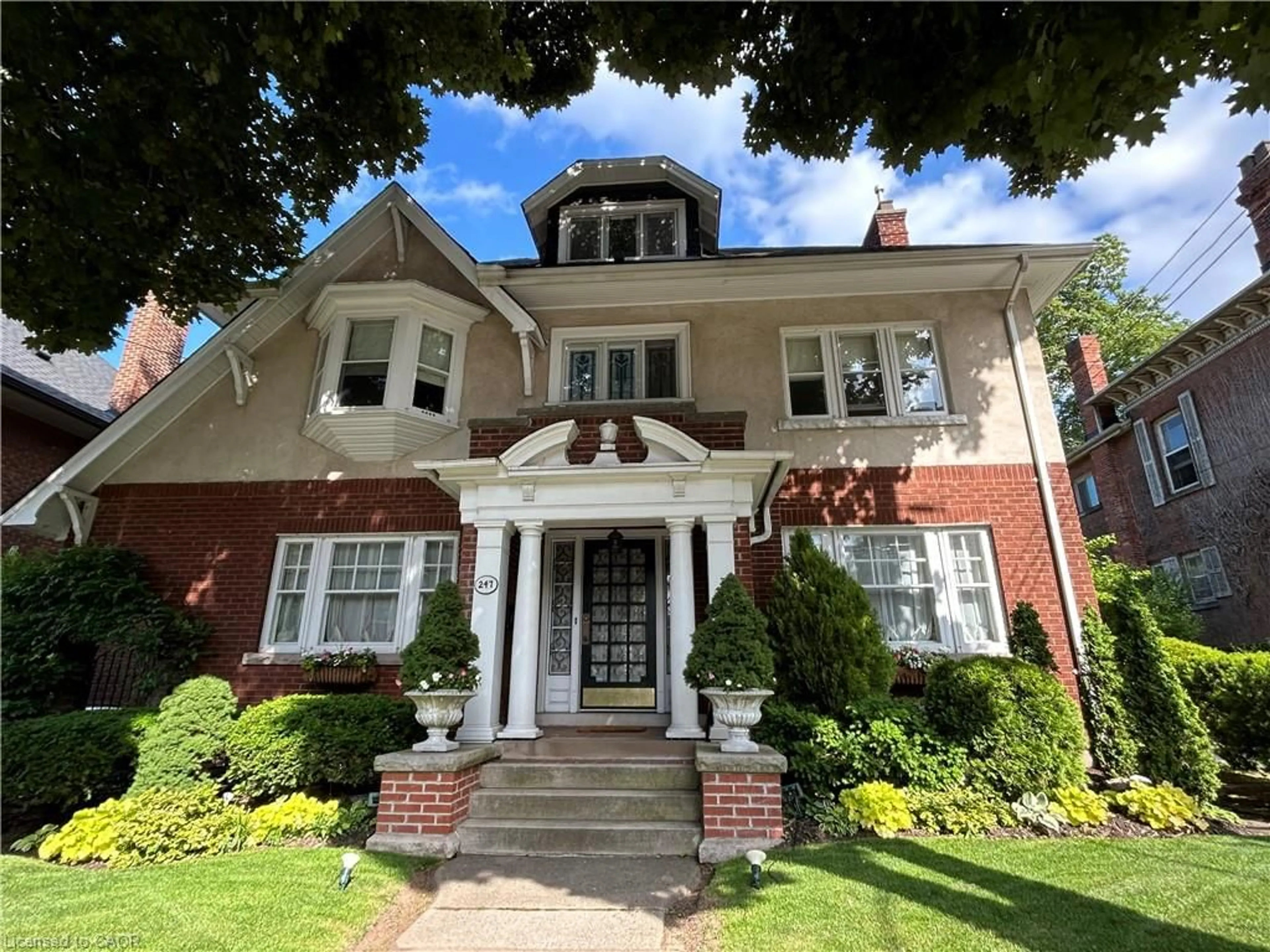 Home with brick exterior material, street for 247 Macnab St, Hamilton Ontario L8P 3E2