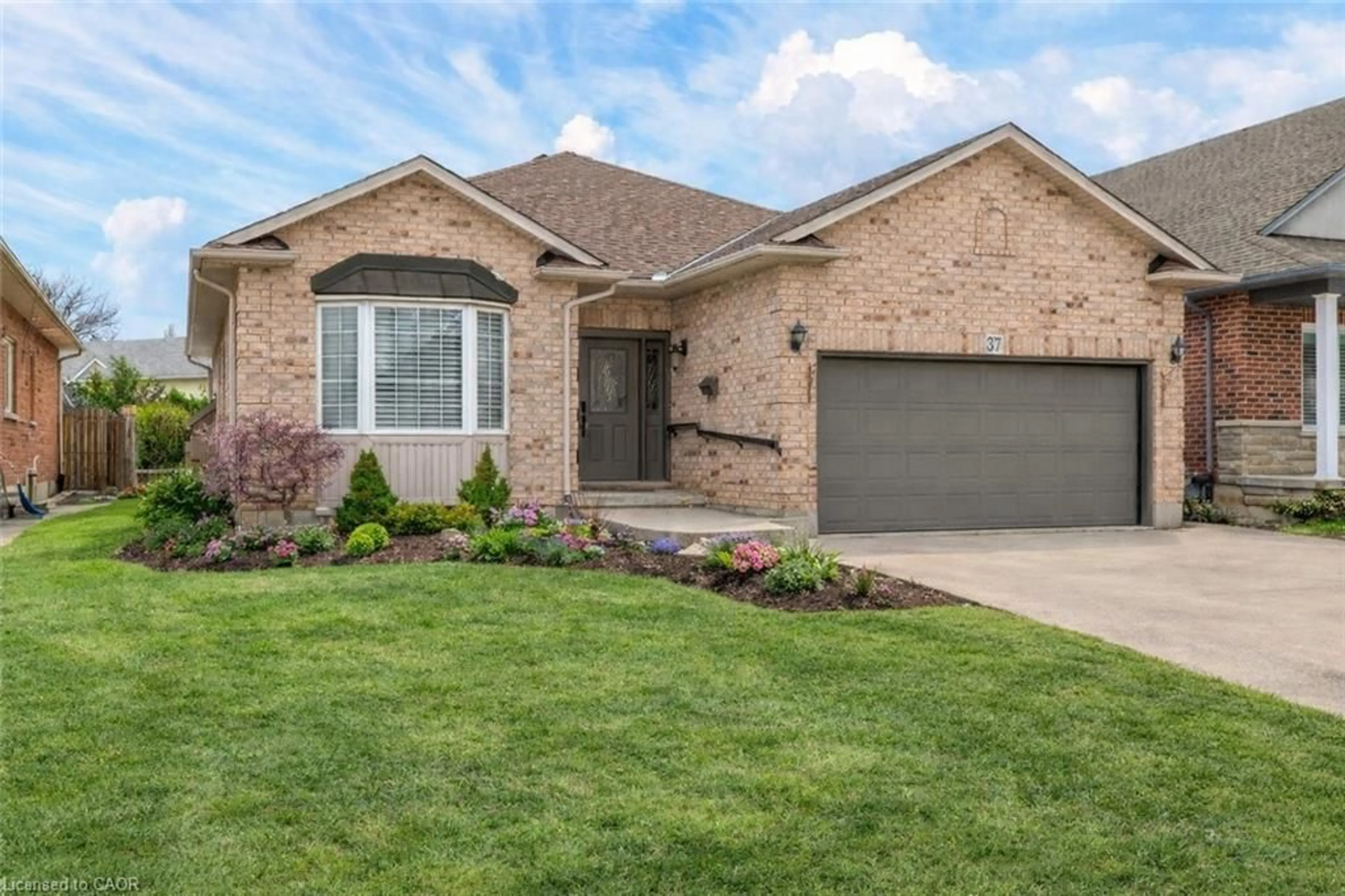 Home with brick exterior material, street for 37 Garth Trails Cres, Hamilton Ontario L9B 2X1