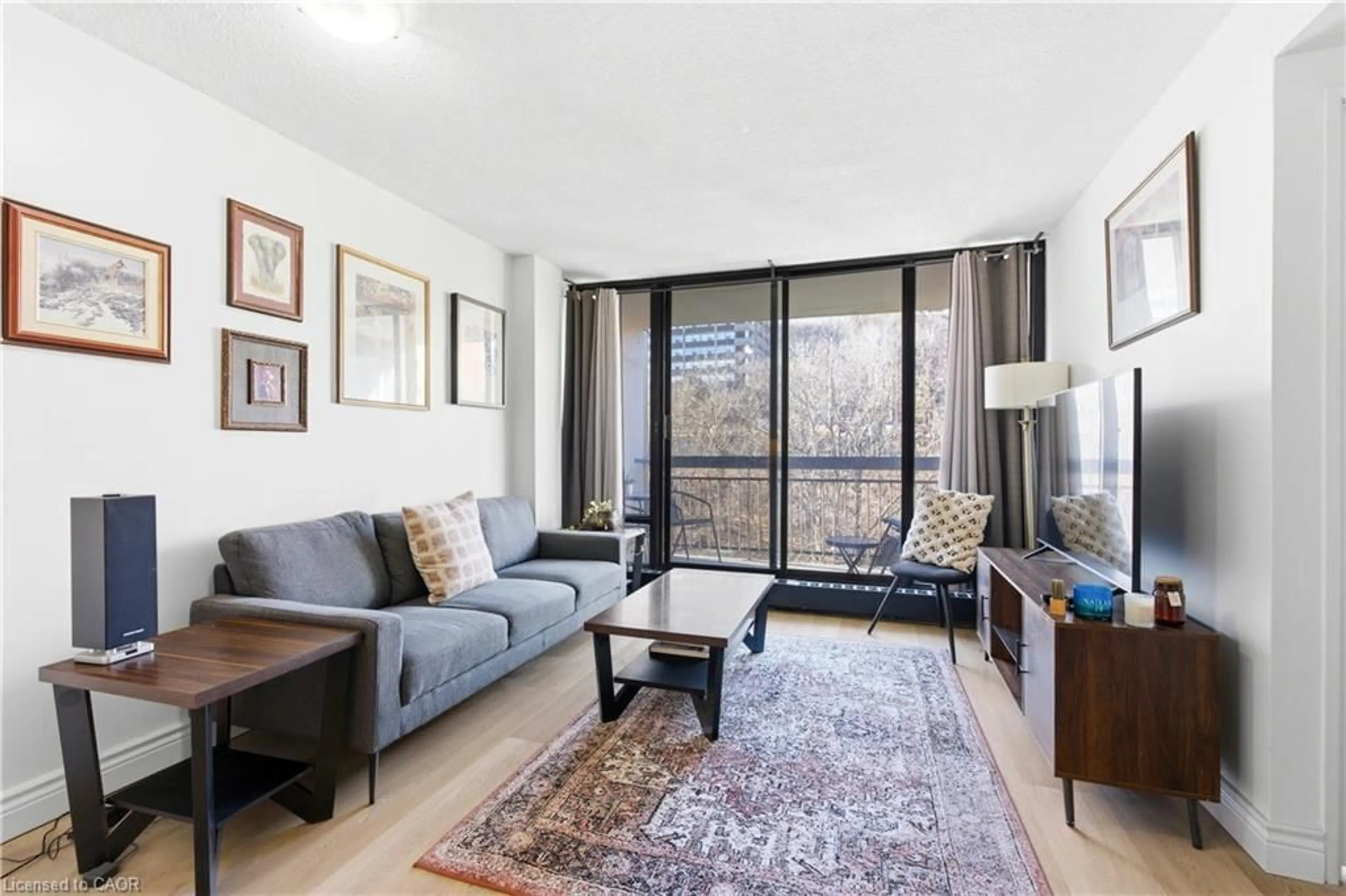 Living room with furniture, unknown for 150 Charlton Ave #805, Hamilton Ontario L8N 3X3