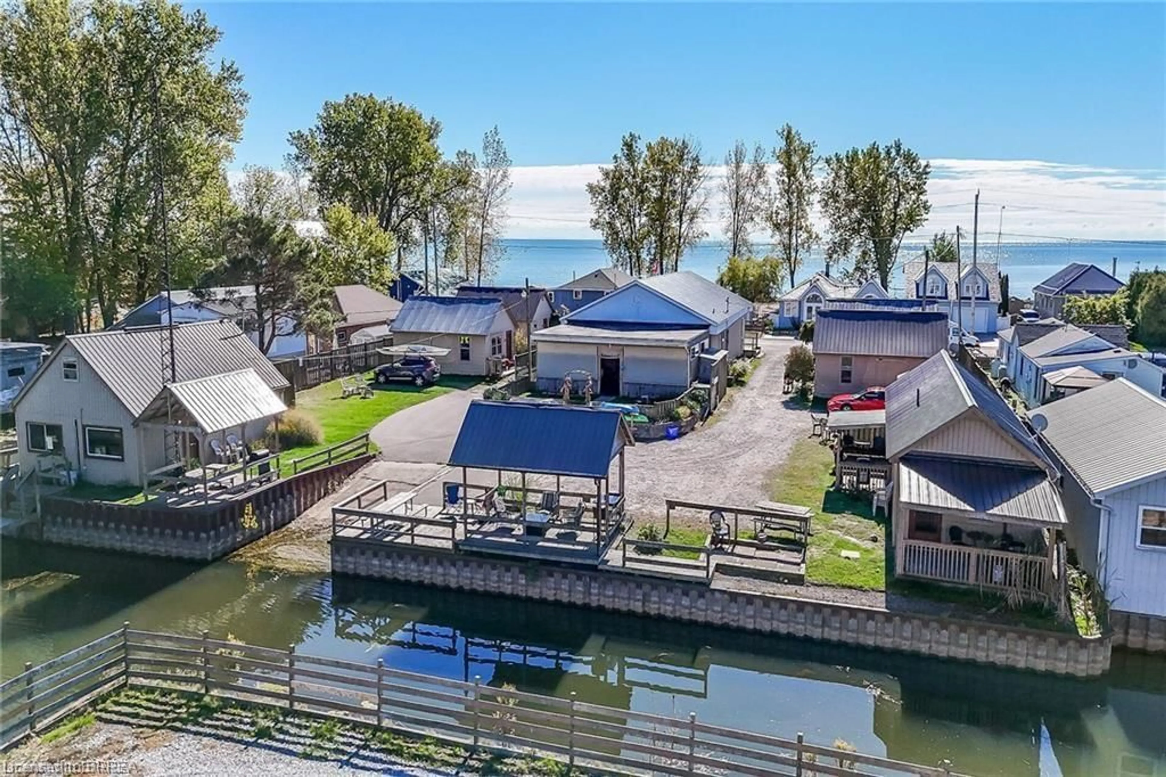 A pic from outside/outdoor area/front of a property/back of a property/a pic from drone, water/lake/river/ocean view for 48-50 Erie Blvd, Long Point Ontario N0E 1M0