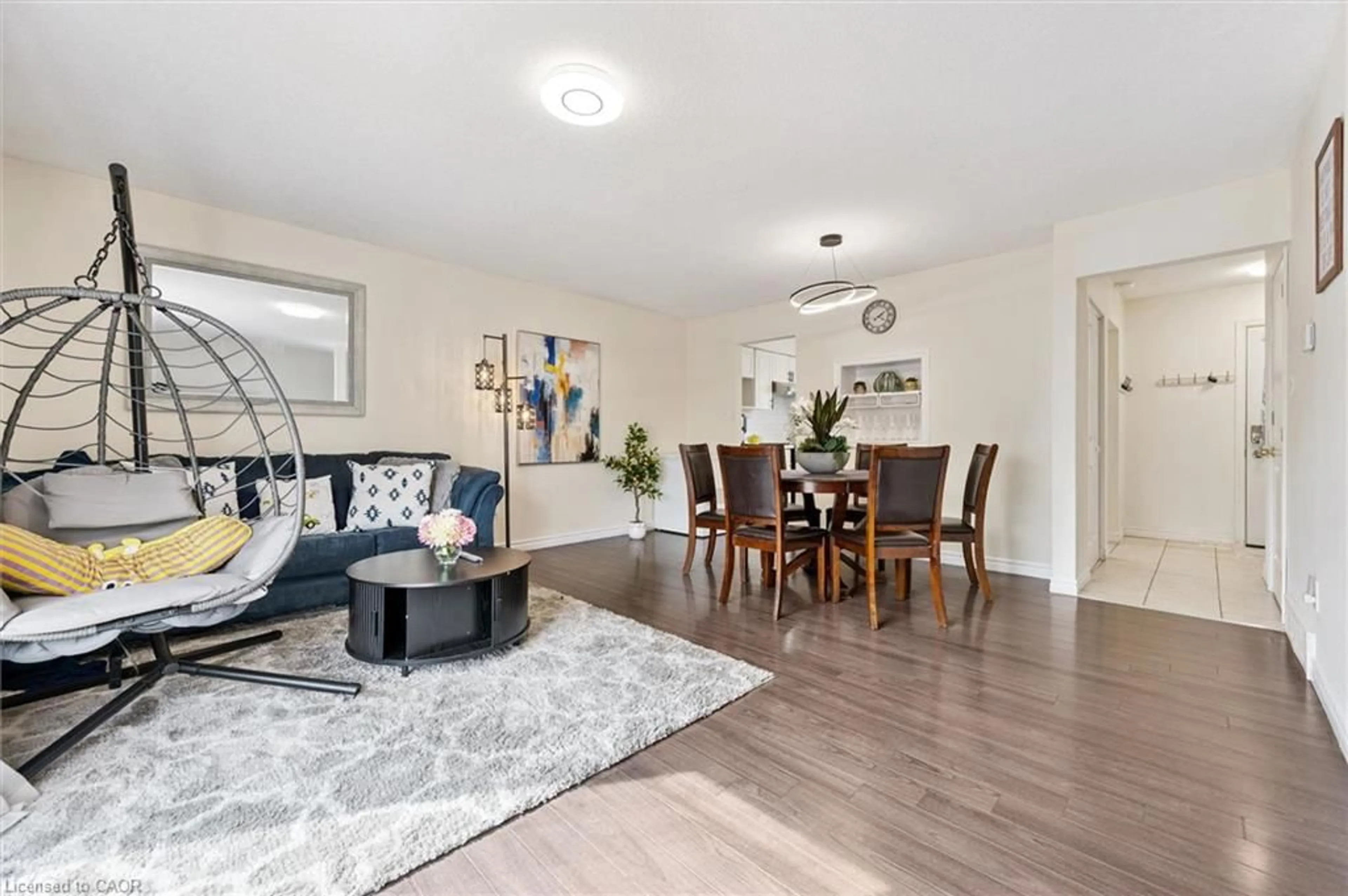 Living room with furniture, wood/laminate floor for 415 Bairstow Cres #5, Waterloo Ontario N2K 2H7