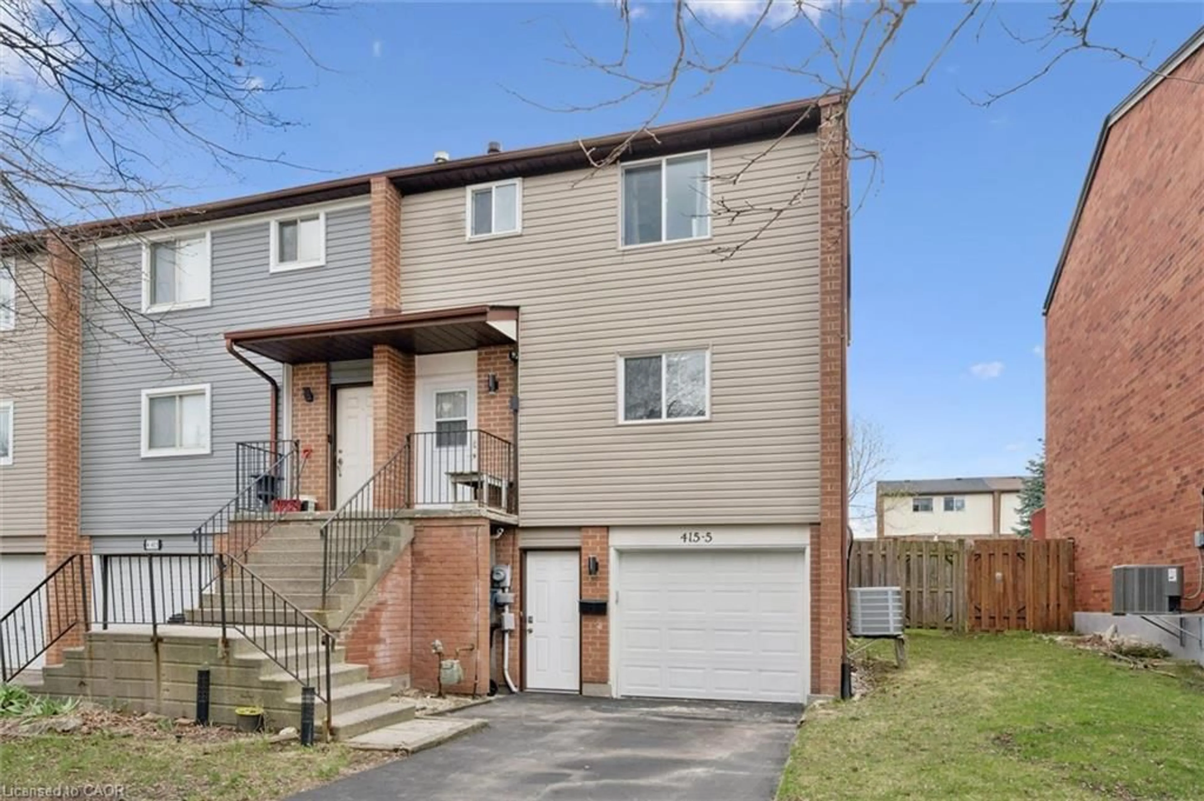 Home with brick exterior material, street for 415 Bairstow Cres #5, Waterloo Ontario N2K 2H7
