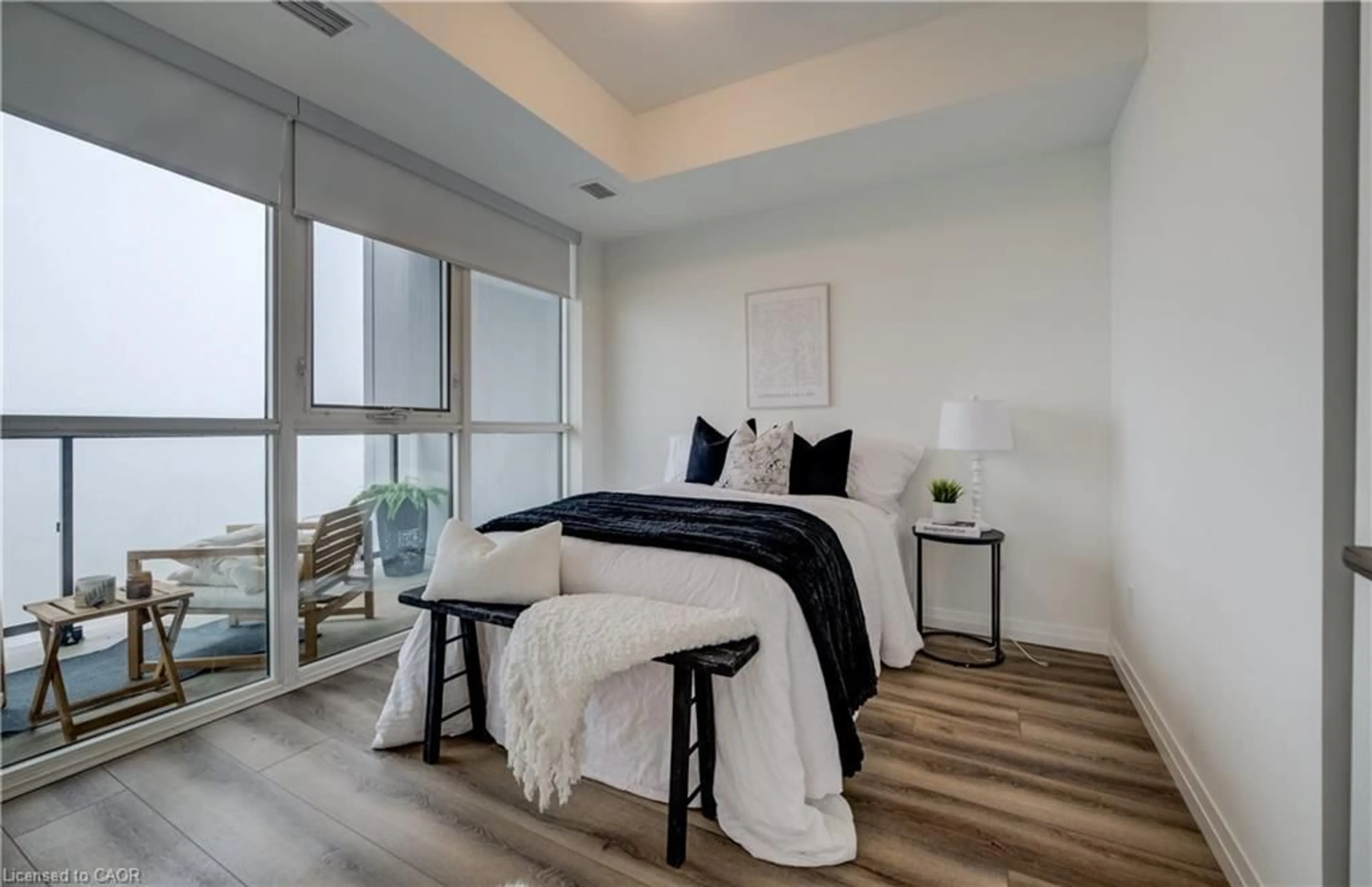 Bedroom with bed, wood/laminate floor for 108 Garment St #2302, Kitchener Ontario N2G 0E2