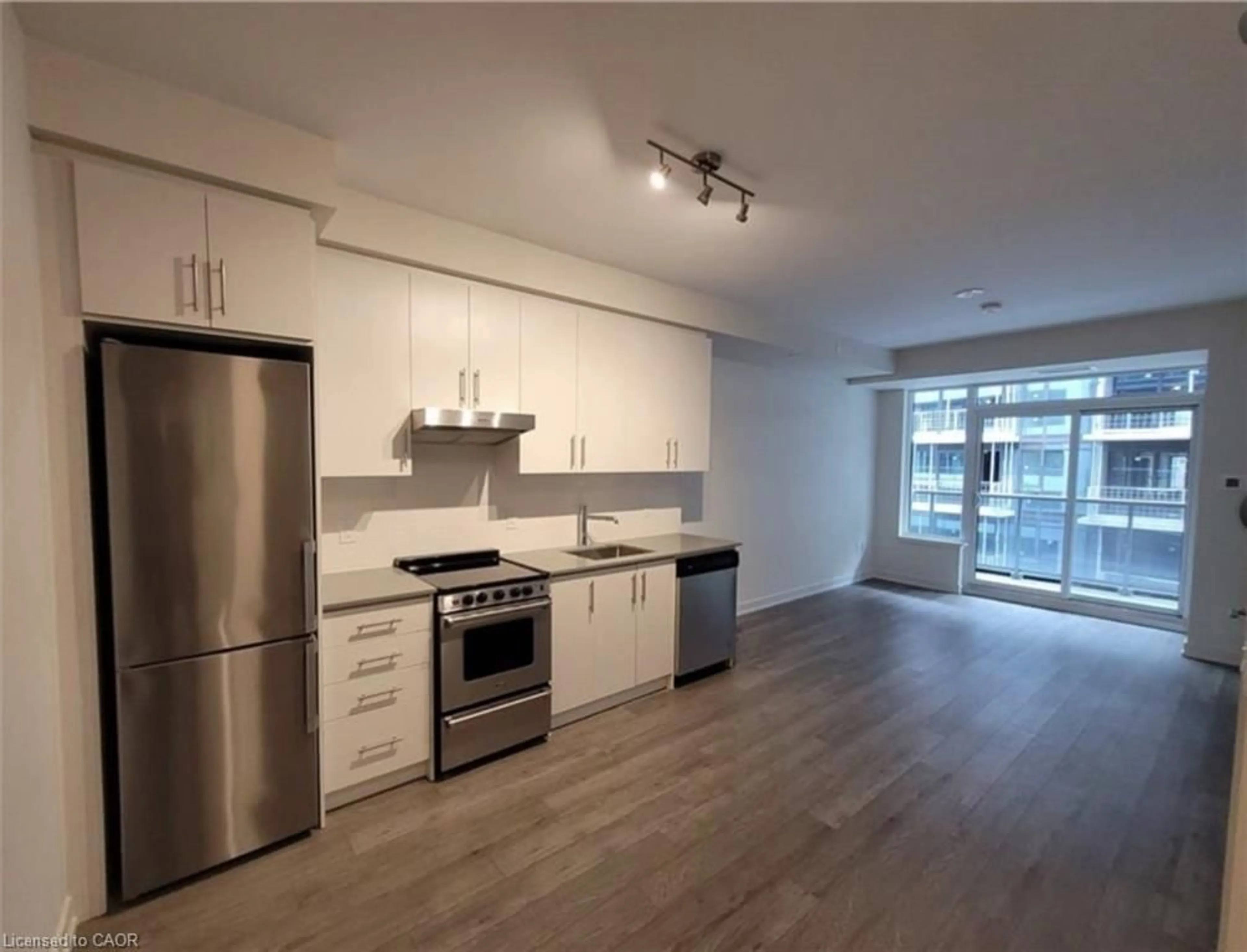 Open concept kitchen, wood/laminate floor for 212 King William St #1109, Hamilton Ontario L8R 0A7