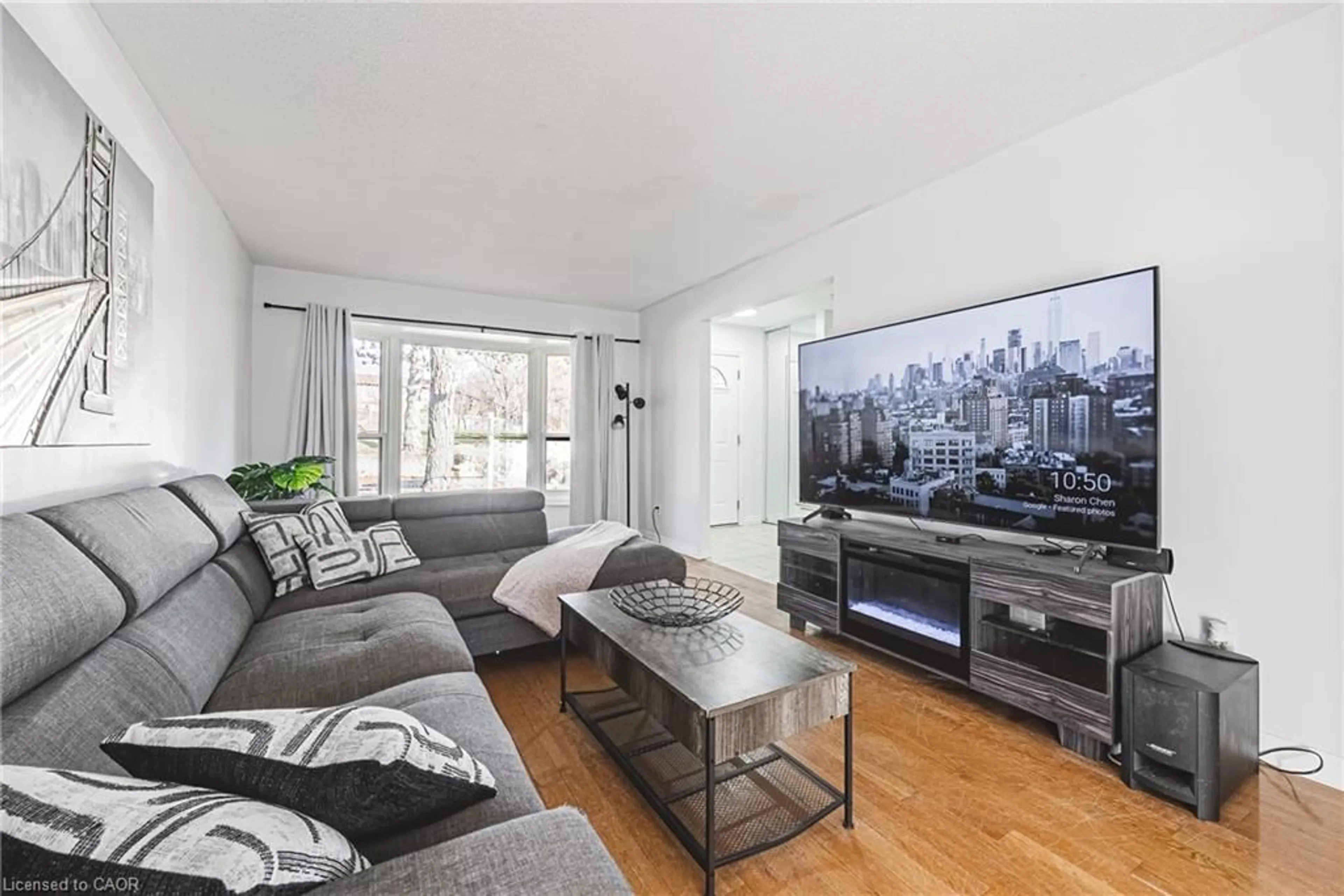 Living room with furniture, wood/laminate floor for 2220 Upper Middle Rd #4, Burlington Ontario L7P 2Z9