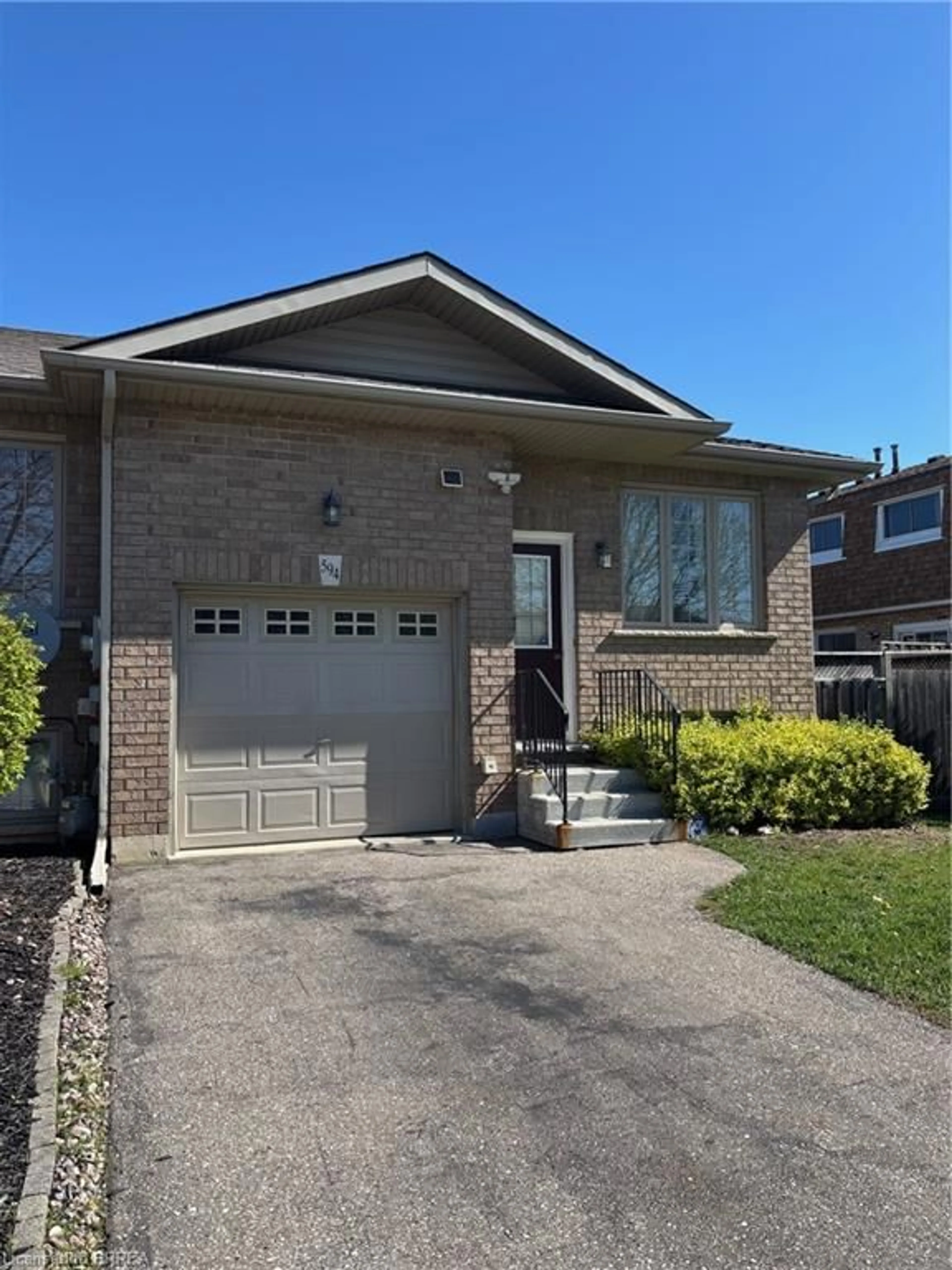 Home with brick exterior material, street for 594 Grey St, Brantford Ontario N3S 4Y1