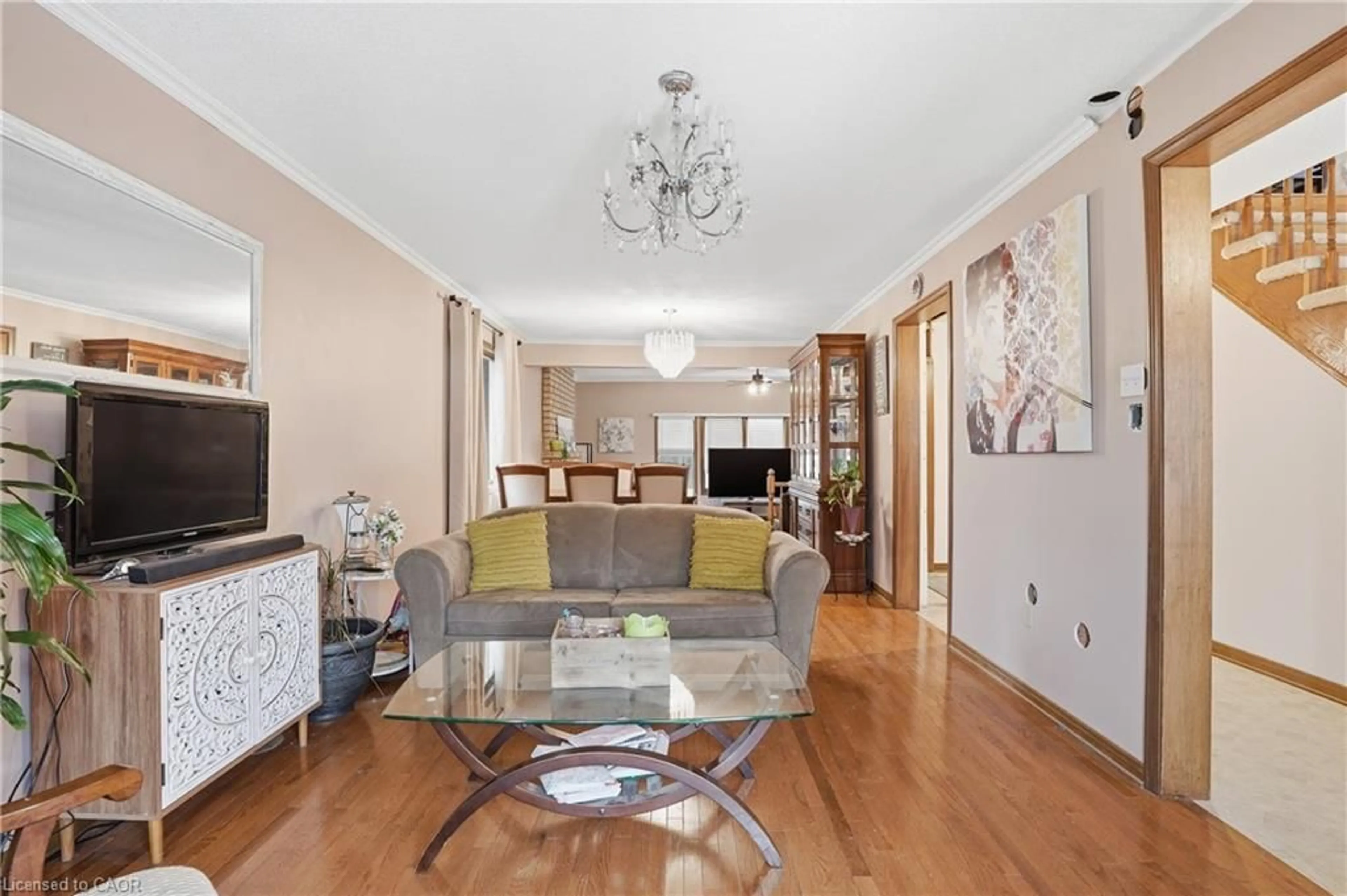 Living room with furniture, wood/laminate floor for 4545 Green Meadow Blvd, Beamsville Ontario L0R 1B5