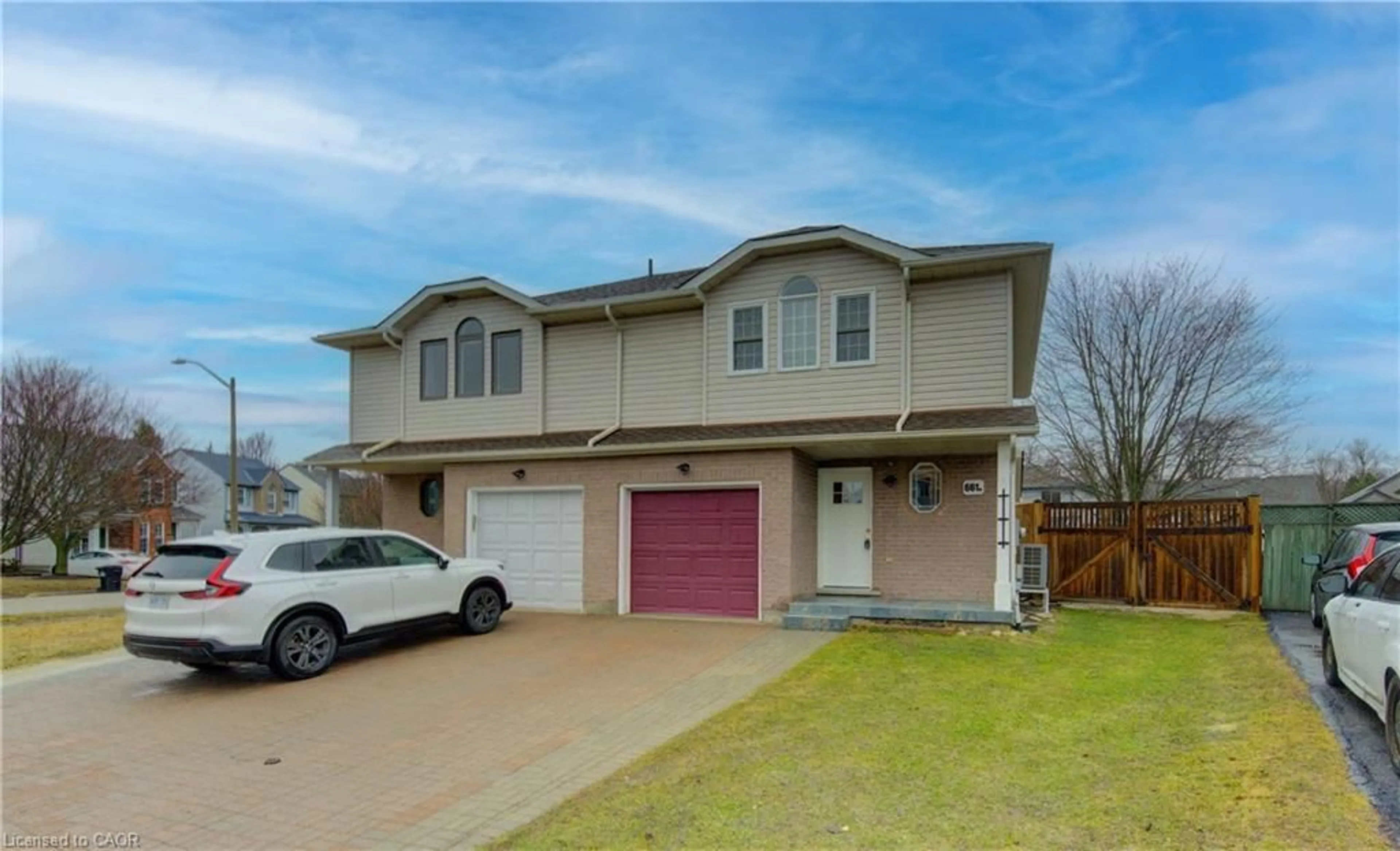 Home with vinyl exterior material, street for 661 Jacob Lane #B, Waterloo Ontario N2V 2G9