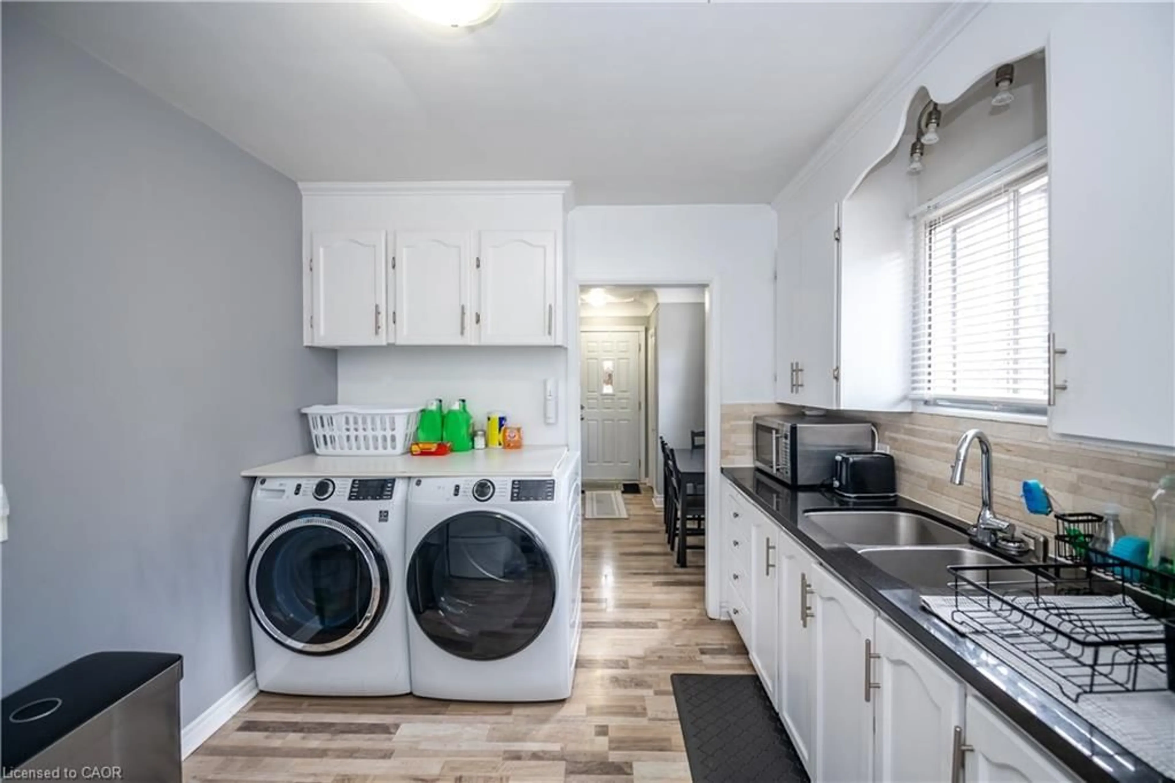 Kitchen with laundary machines, unknown for 62 Harold Crt, Hamilton Ontario L8S 2R9