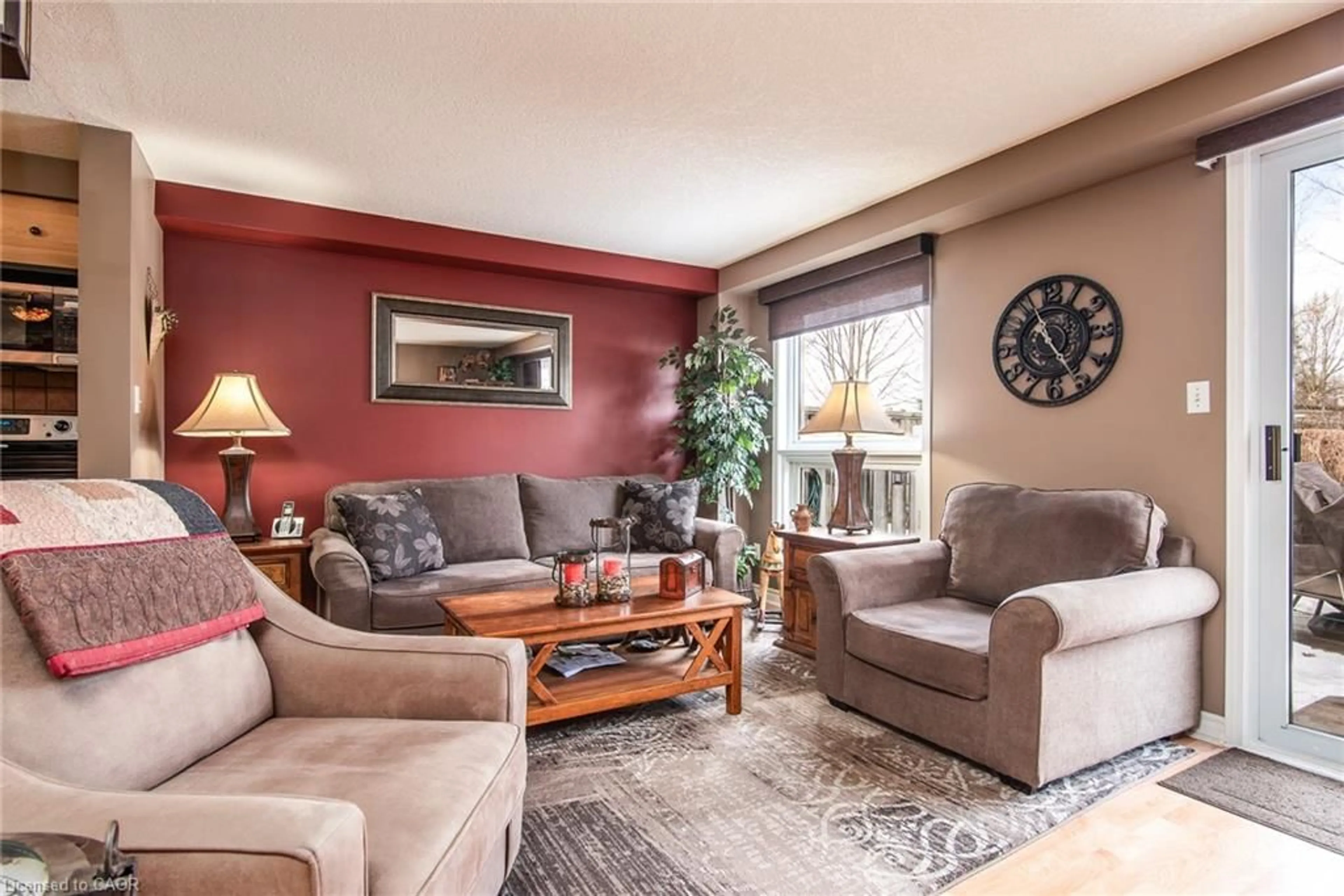 Living room with furniture, wood/laminate floor for 115 Activa Ave, Kitchener Ontario N2E 3T3