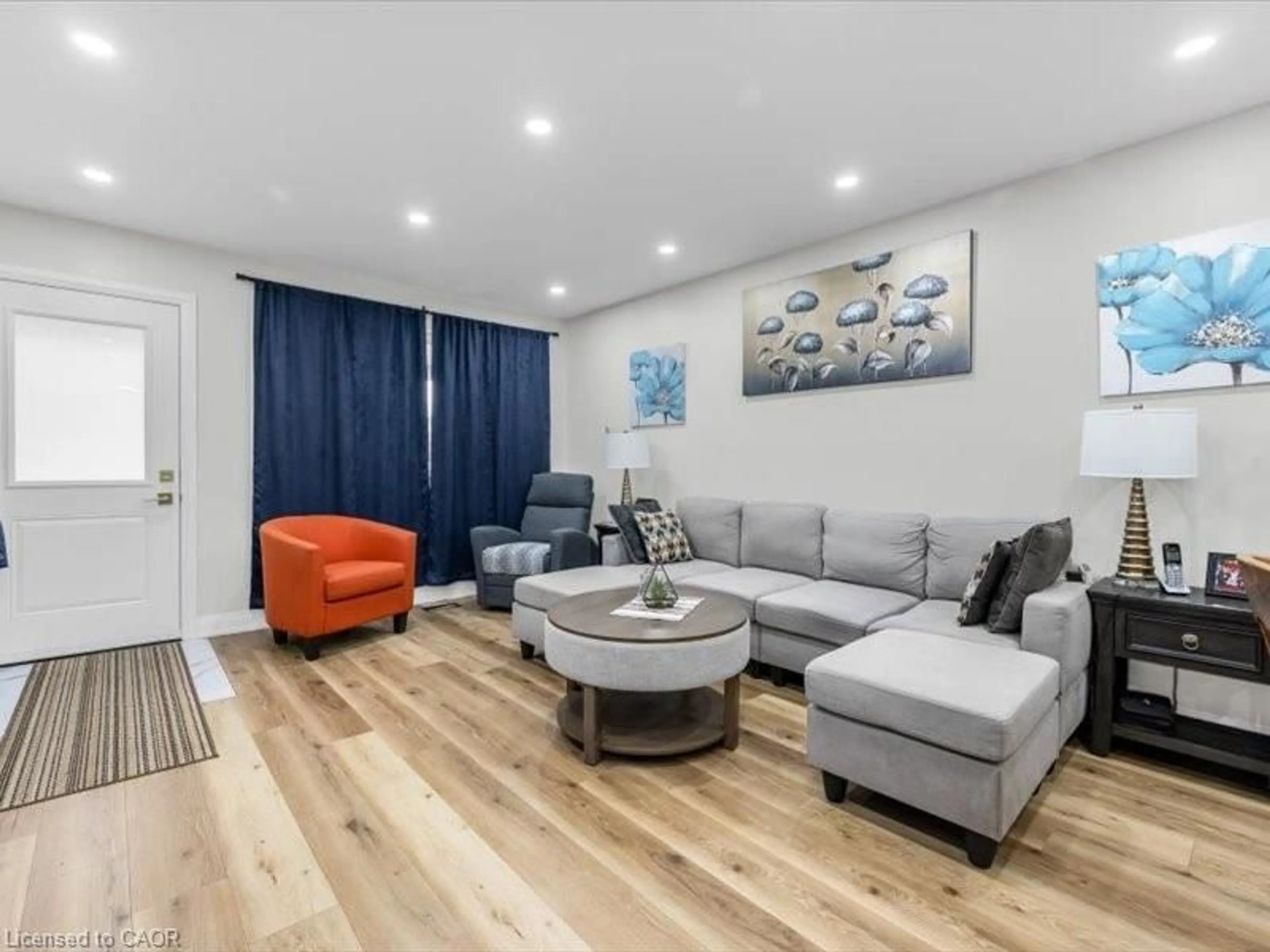 Living room with furniture, wood/laminate floor for 65 Loraine Dr, St. Catharines Ontario L2P 3P1