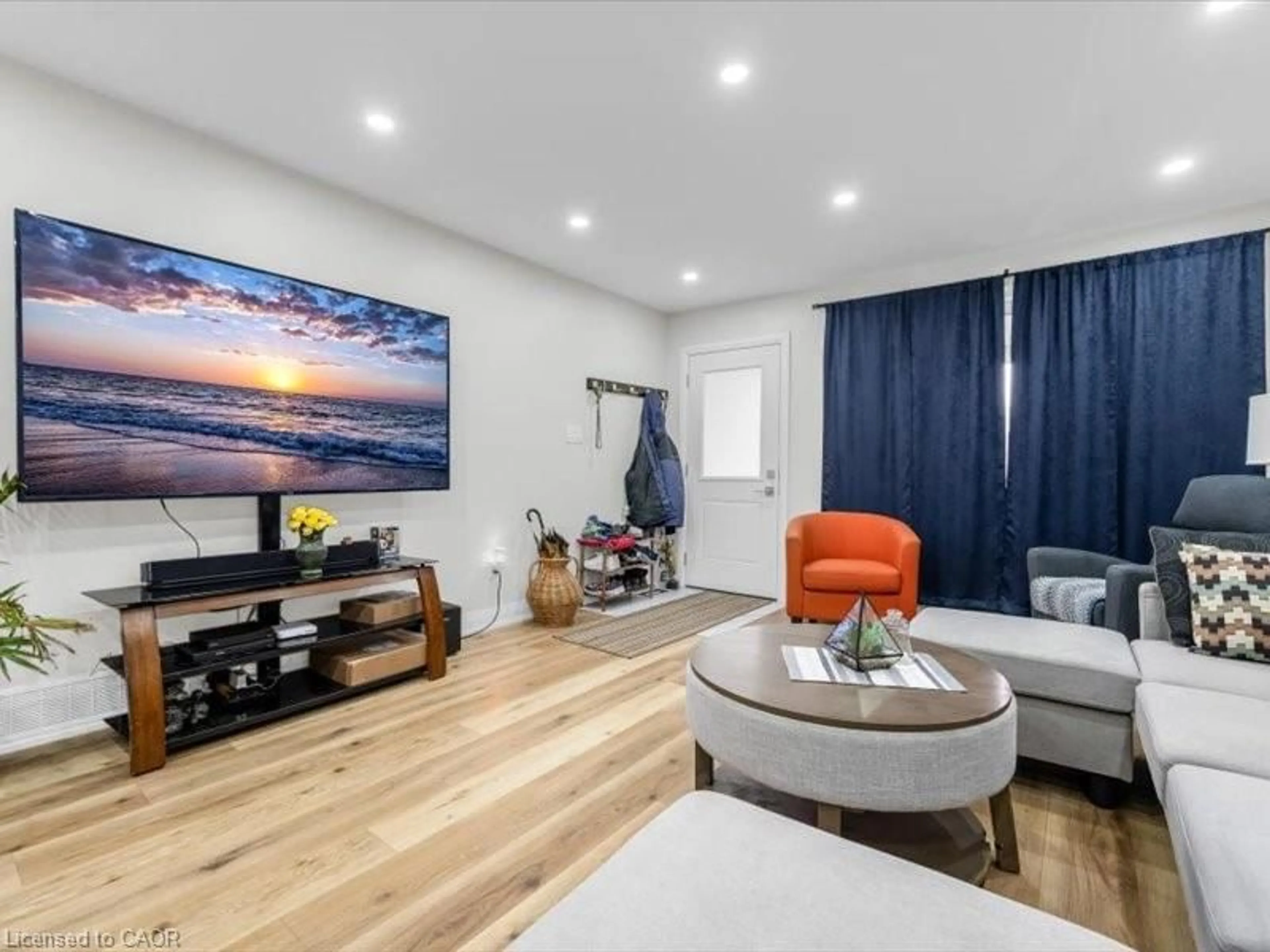 Living room with furniture, wood/laminate floor for 65 Loraine Dr, St. Catharines Ontario L2P 3P1