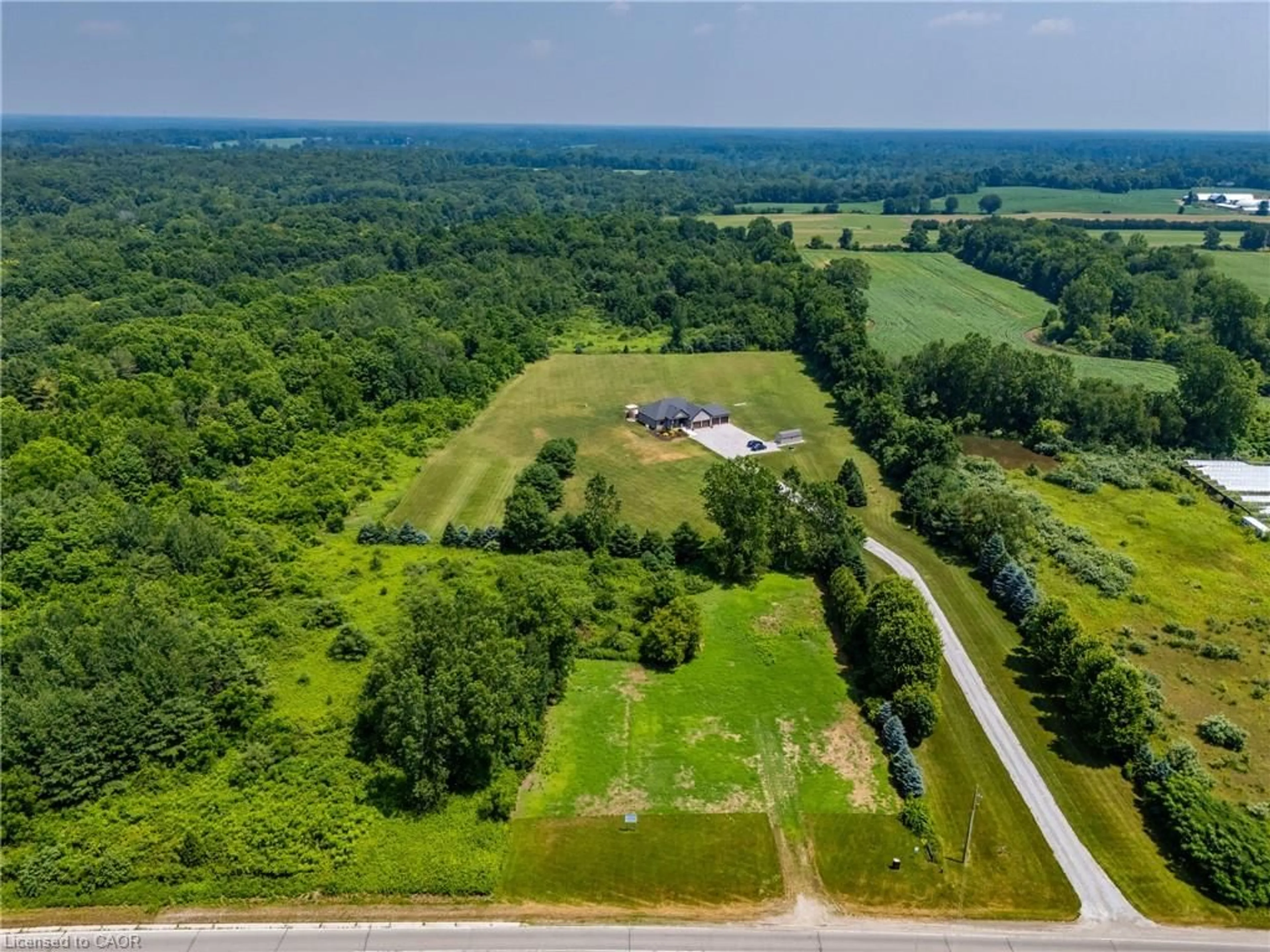 A pic from outside/outdoor area/front of a property/back of a property/a pic from drone, unknown for 2554 Highway 59, Langton Ontario N0E 1G0