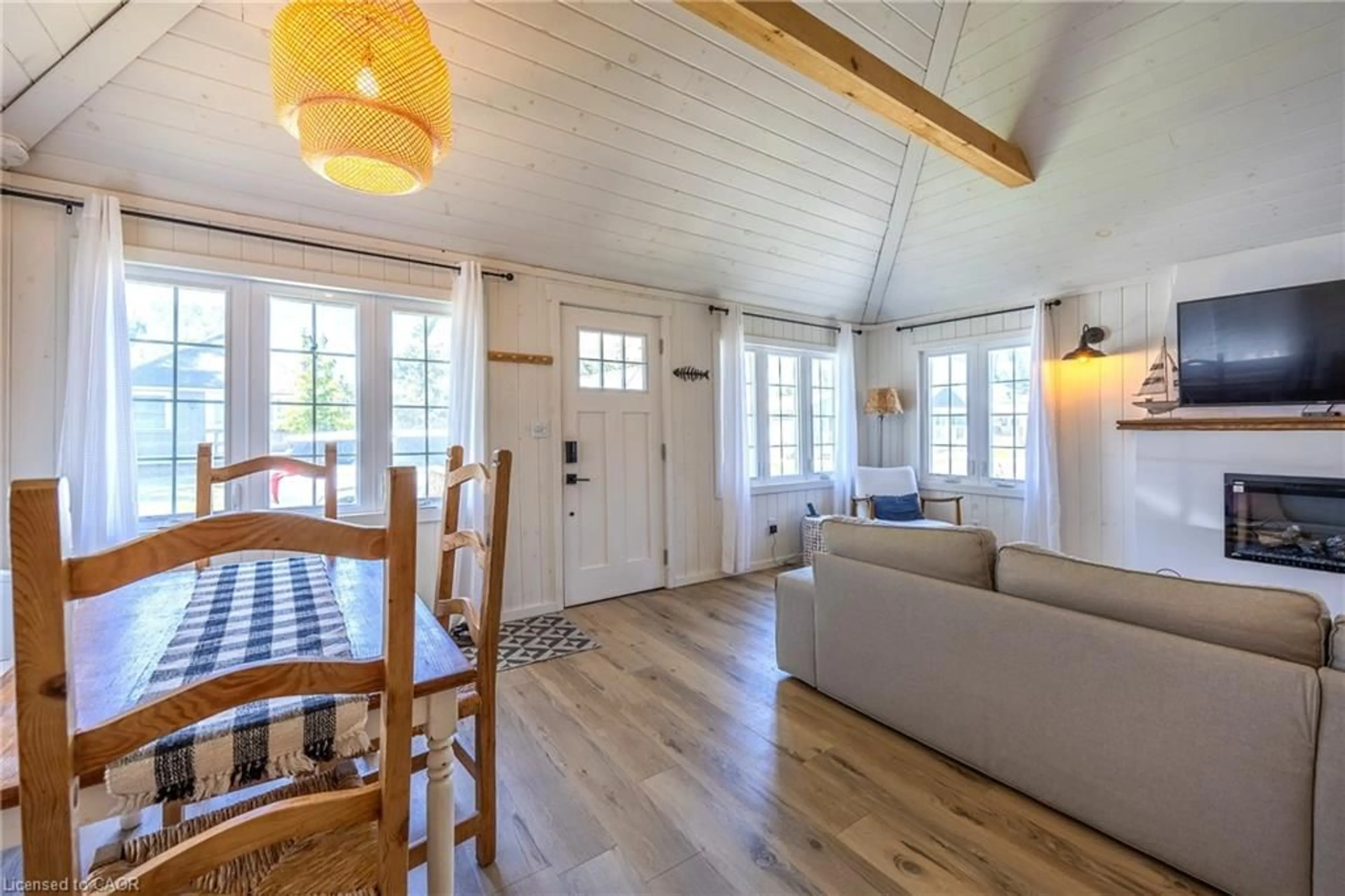 Living room with furniture, wood/laminate floor for 11 Bass Lane, Long Point Ontario N0E 1M0