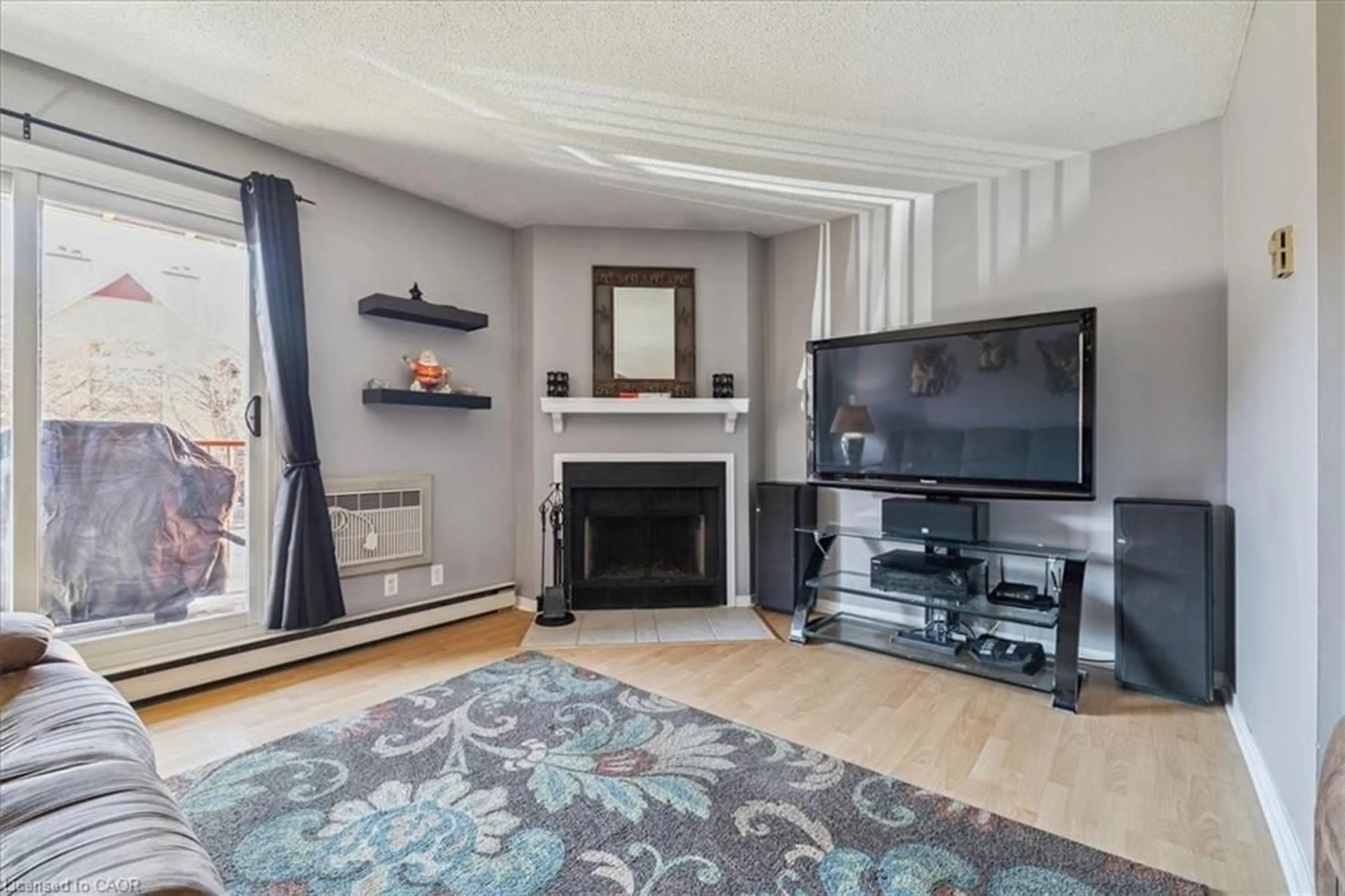 Living room with furniture, wood/laminate floor for 1480 Pilgrims Way, Oakville Ontario L6M 3G7