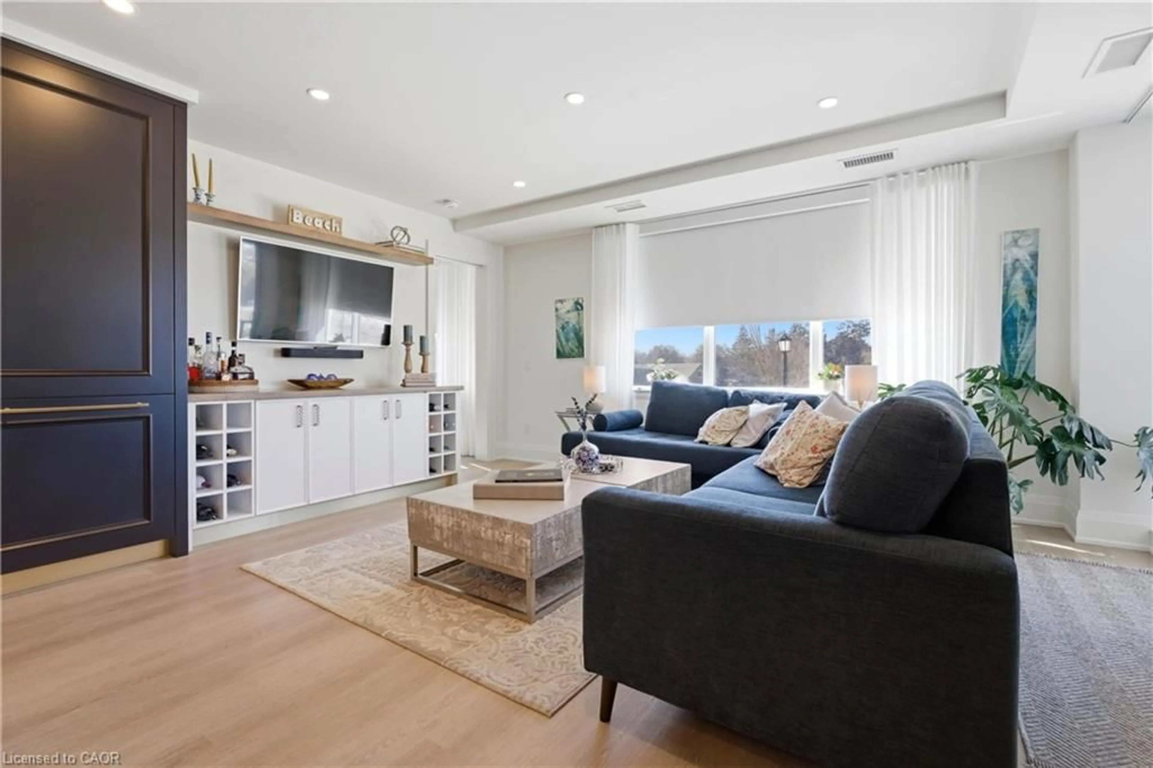 Living room with furniture, wood/laminate floor for 6523 Wellington Road 7 Rd #213, Elora Ontario N0B 1S0