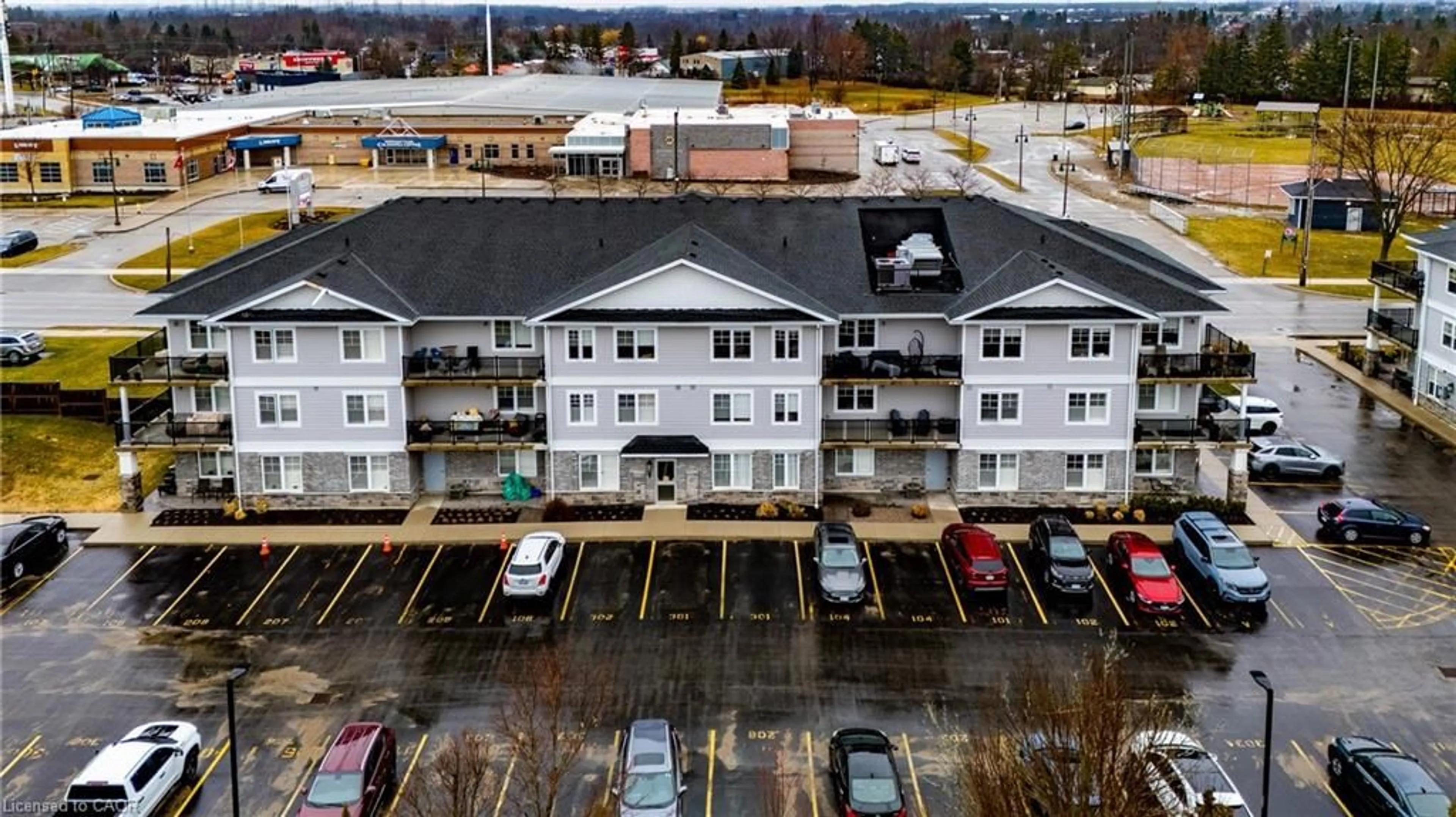A pic from outside/outdoor area/front of a property/back of a property/a pic from drone, building for 65 Haddington St #203, Caledonia Ontario N3W 2H2