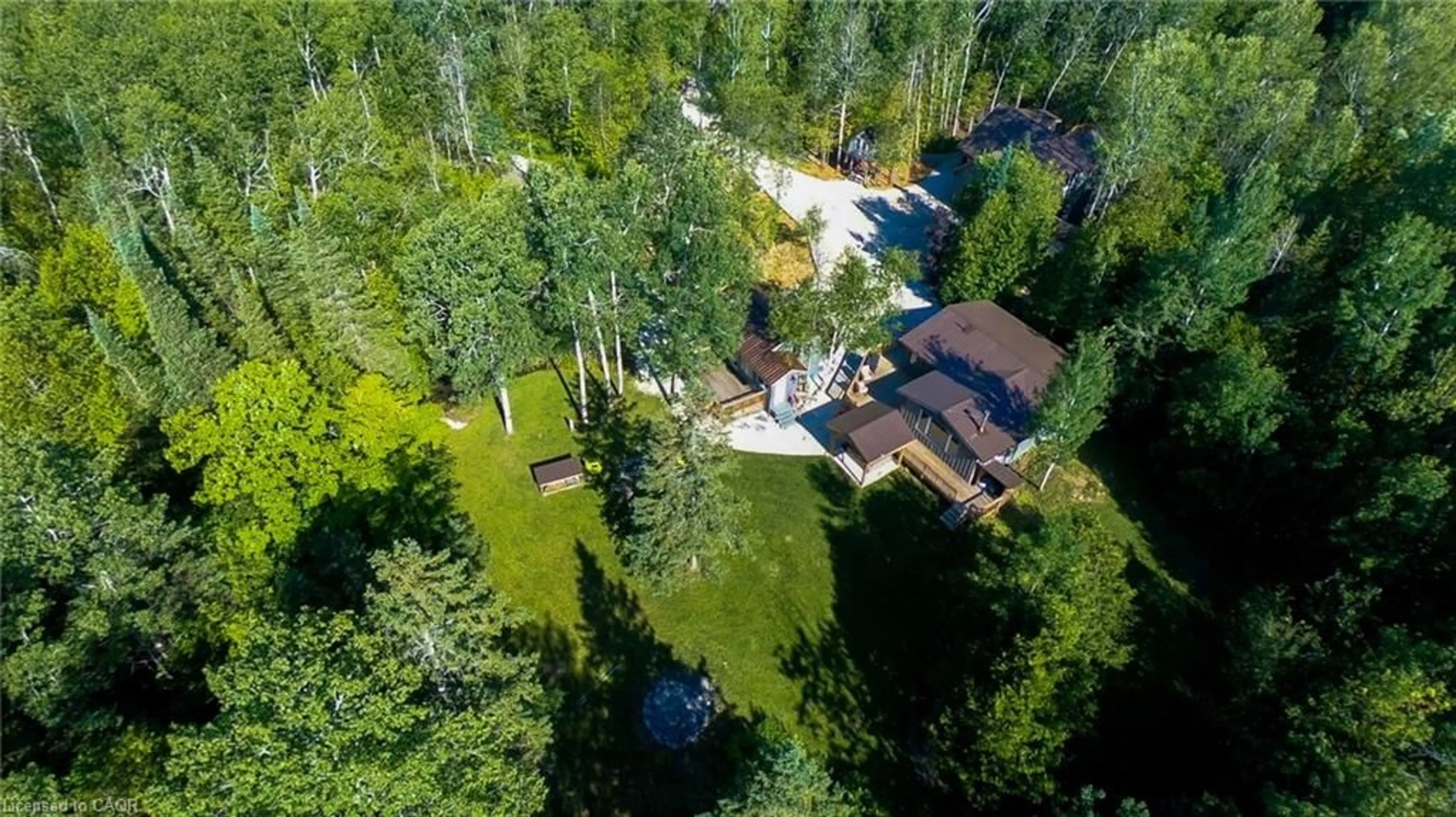 A pic from outside/outdoor area/front of a property/back of a property/a pic from drone, forest/trees view for 102 Cape Chin Rd, Lions Head Ontario N0H 1W0