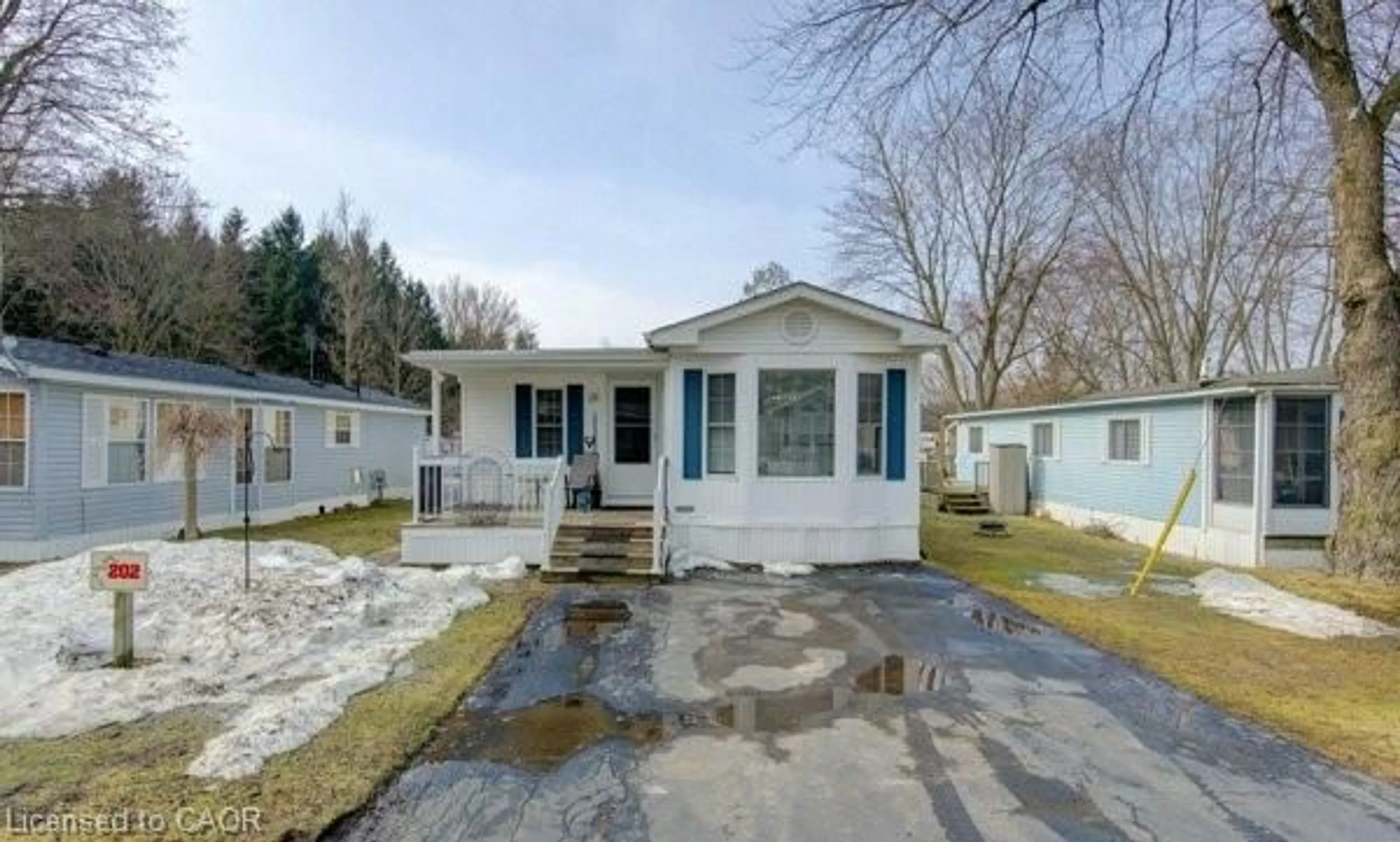 Home with vinyl exterior material, street for 580 Beaver Creek Rd #202, Waterloo Ontario N2J 3Z4