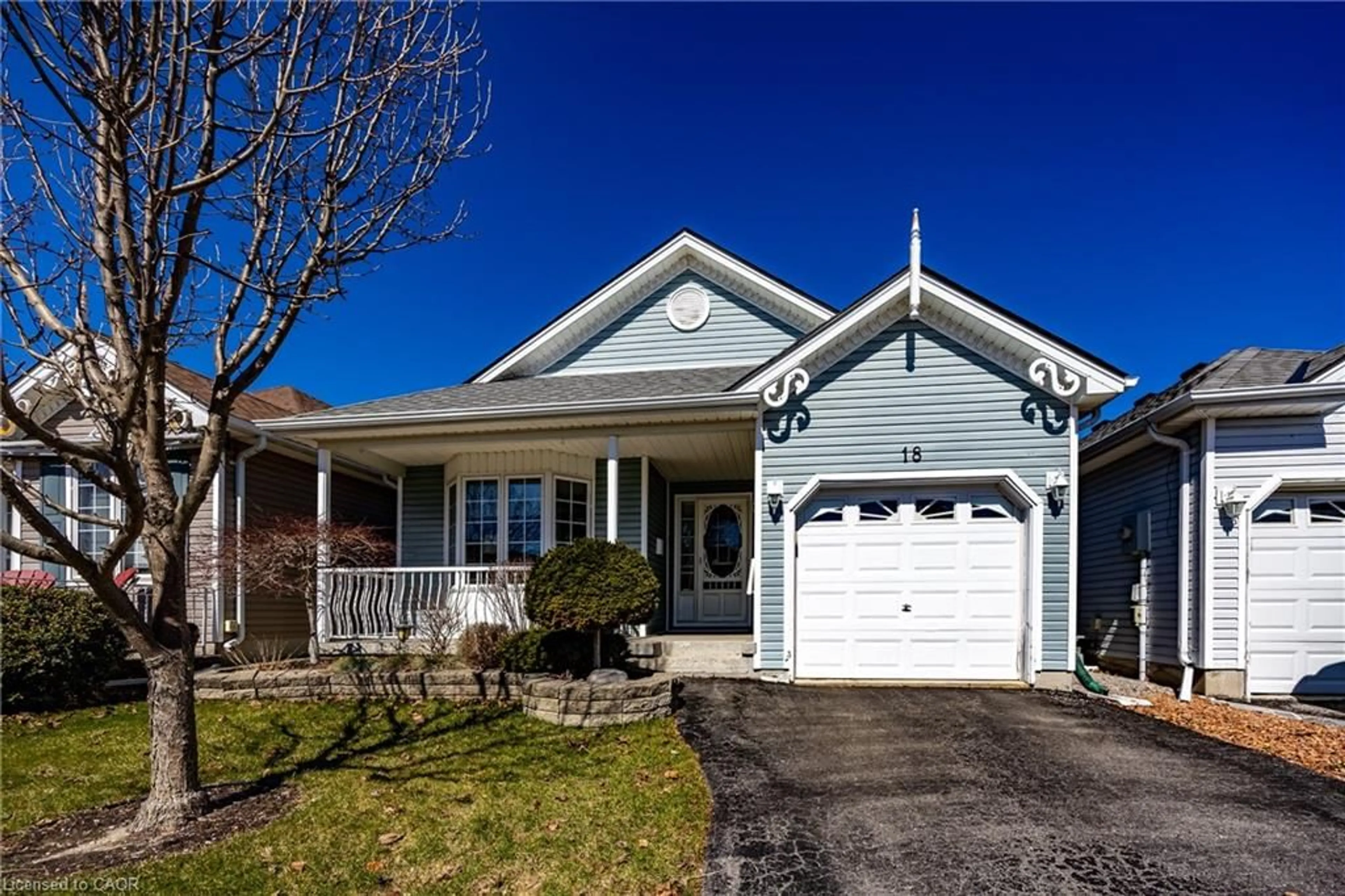 Home with vinyl exterior material, street for 18 Carolina Way, Port Rowan Ontario N0E 1M0