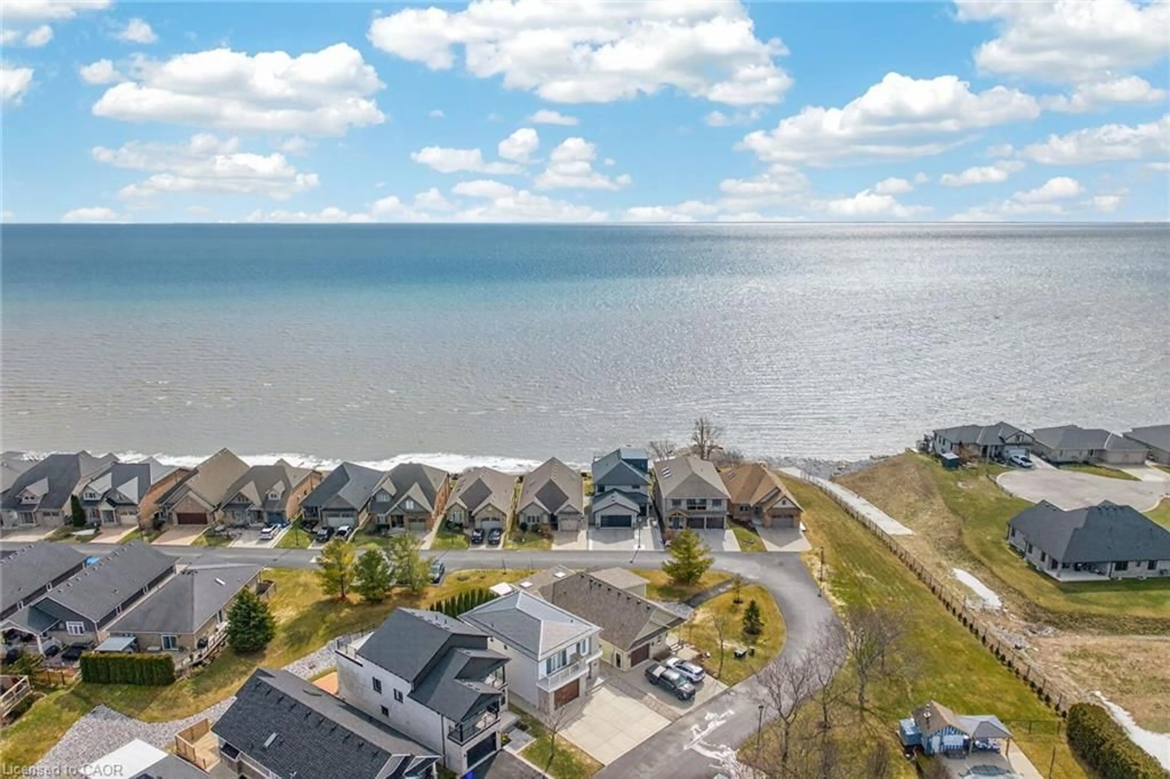 A pic from outside/outdoor area/front of a property/back of a property/a pic from drone, water/lake/river/ocean view for 80 New Lakeshore Rd #16, Port Dover Ontario N0A 1N8