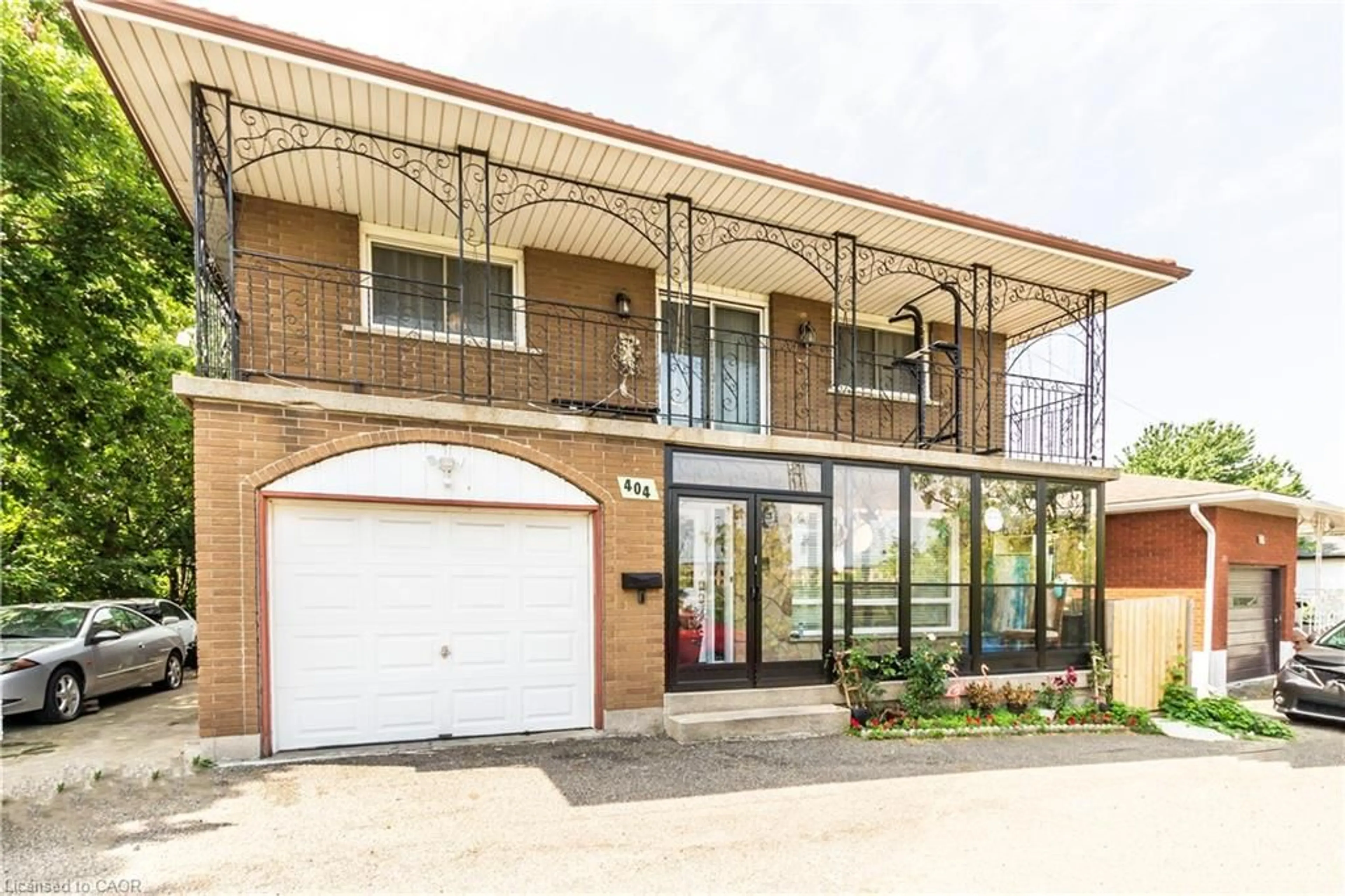 Home with brick exterior material, street for 404 Queenston Rd, Hamilton Ontario L8K 1J2