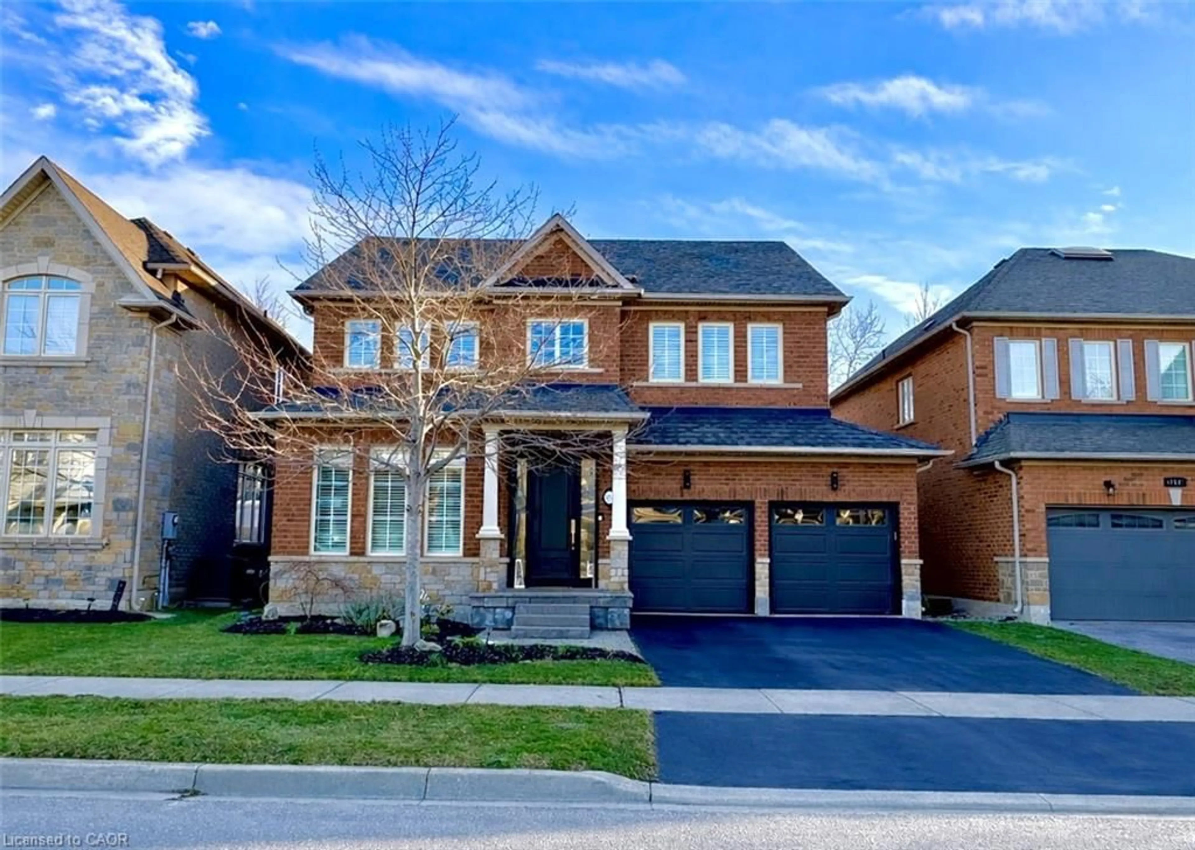 Home with brick exterior material, street for 273 Duskywing Way, Oakville Ontario L6L 6X5