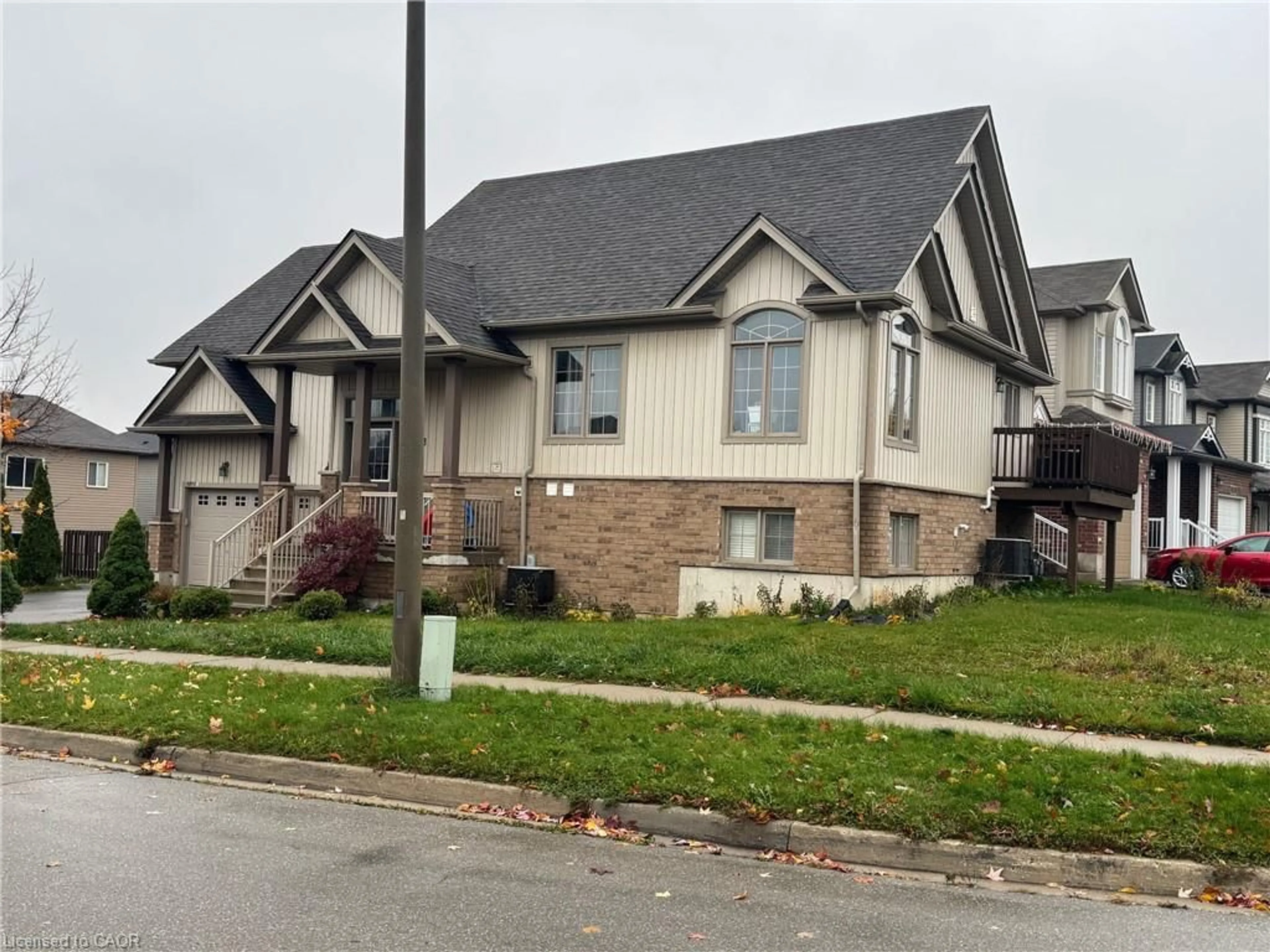 Home with vinyl exterior material, street for 1273 Countrystone Dr, Kitchener Ontario N2N 3S4