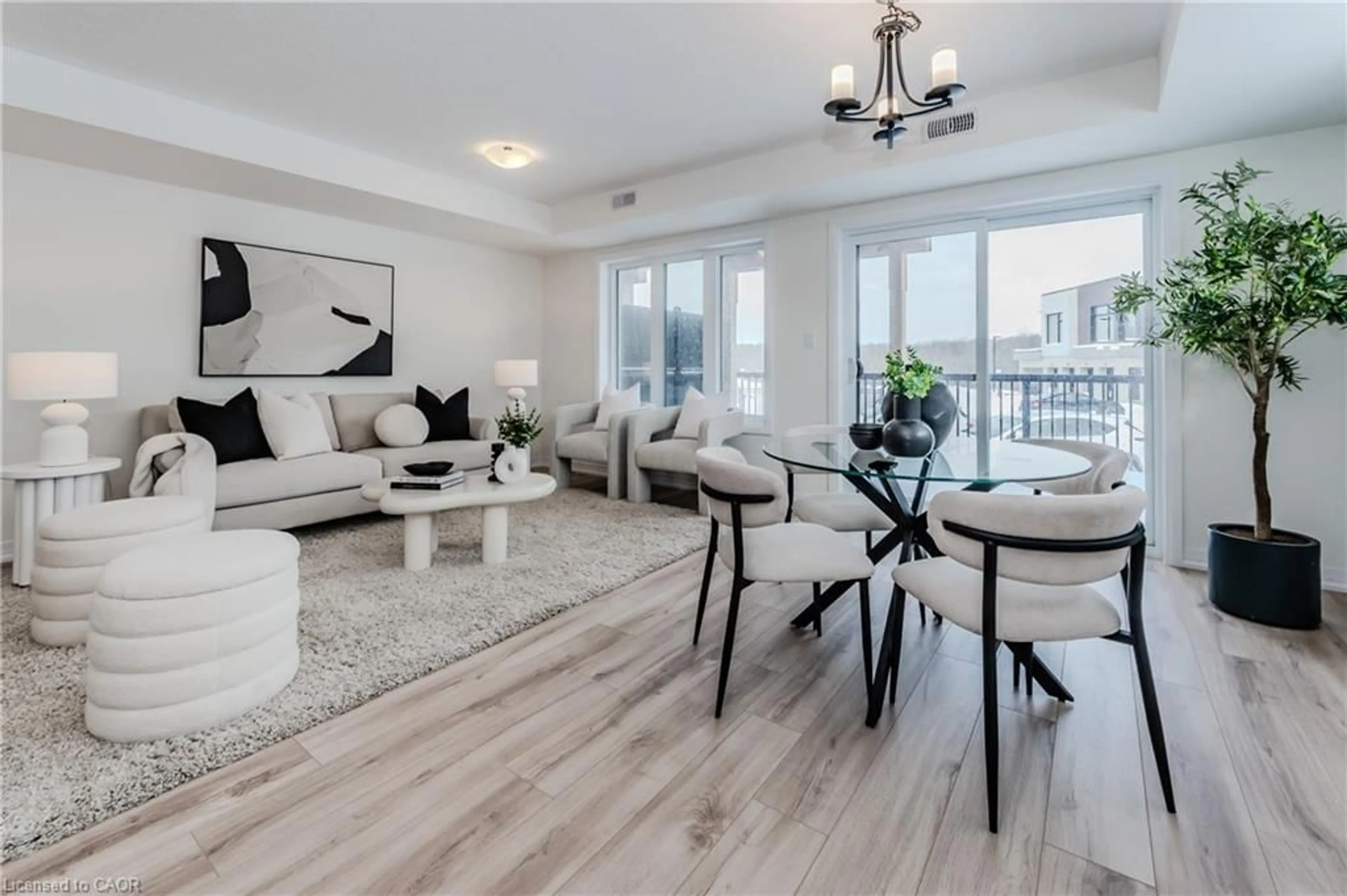 Living room with furniture, wood/laminate floor for 15 Stauffer Woods Trail #A4, Kitchener Ontario N2P 2P4