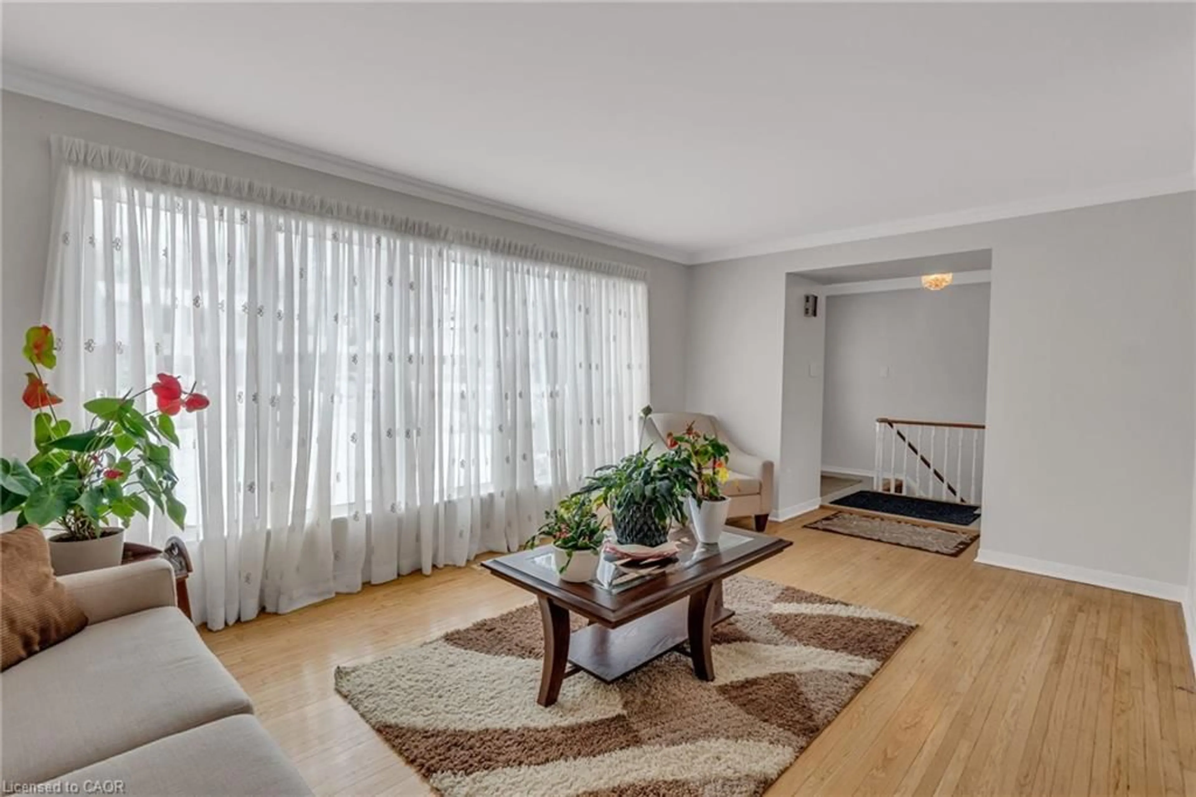 Living room with furniture, unknown for 56 Brookland Dr, Brampton Ontario L6T 2M5