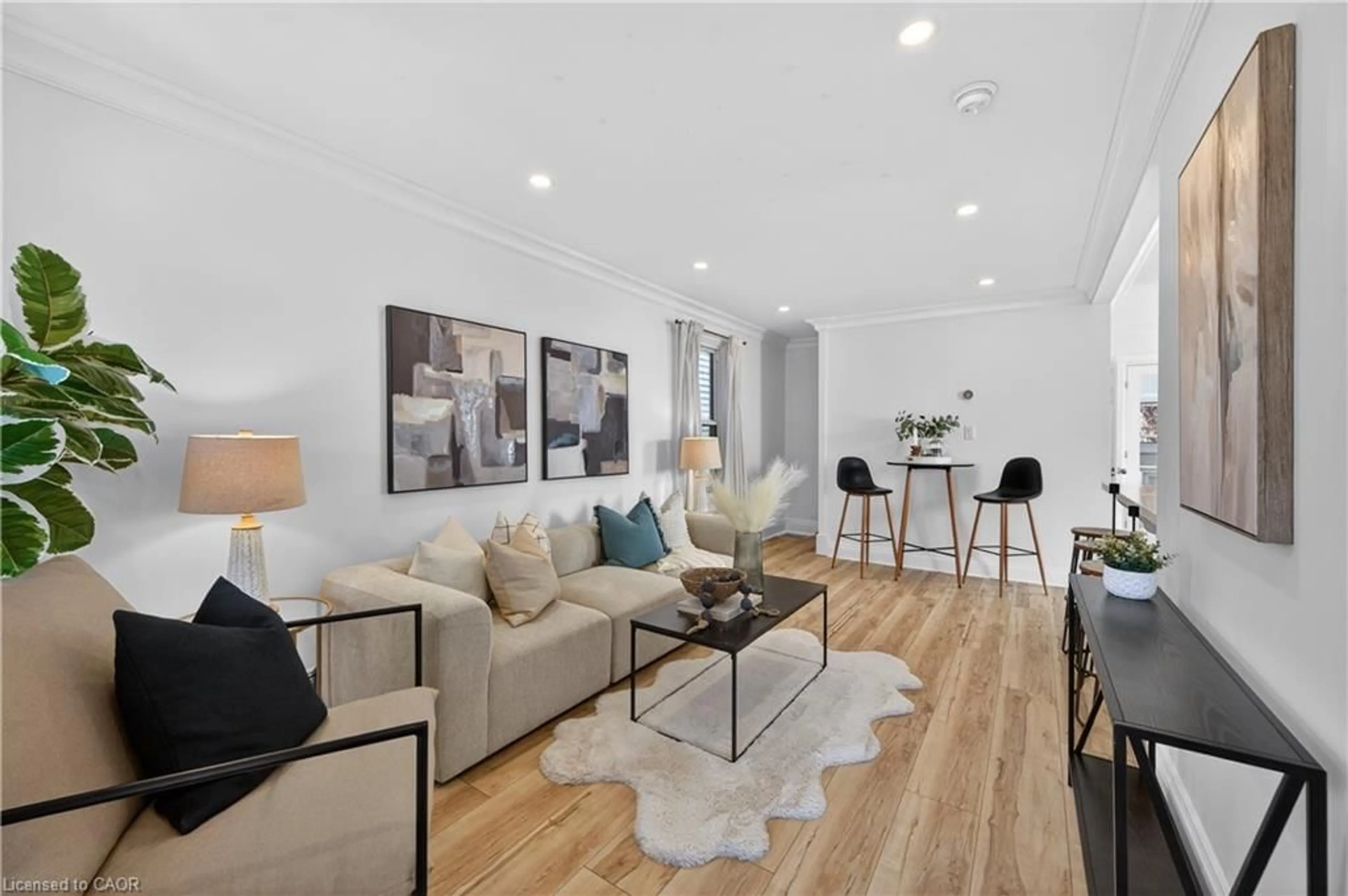 Living room with furniture, wood/laminate floor for 8 East 23rd St, Hamilton Ontario L8V 2W6