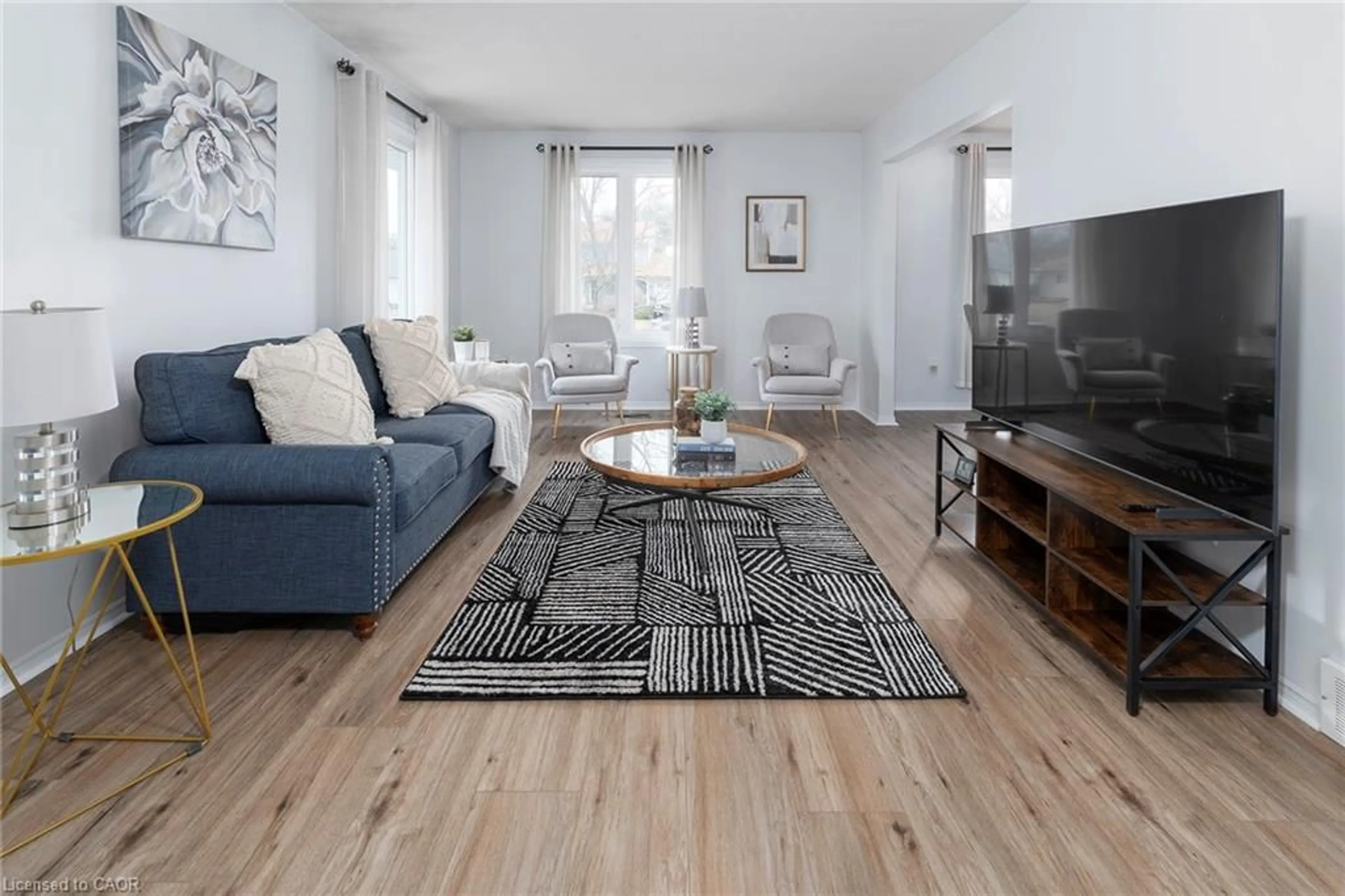 Living room with furniture, wood/laminate floor for 461 Belleair Blvd, Ridgeway Ontario L0S 1N0