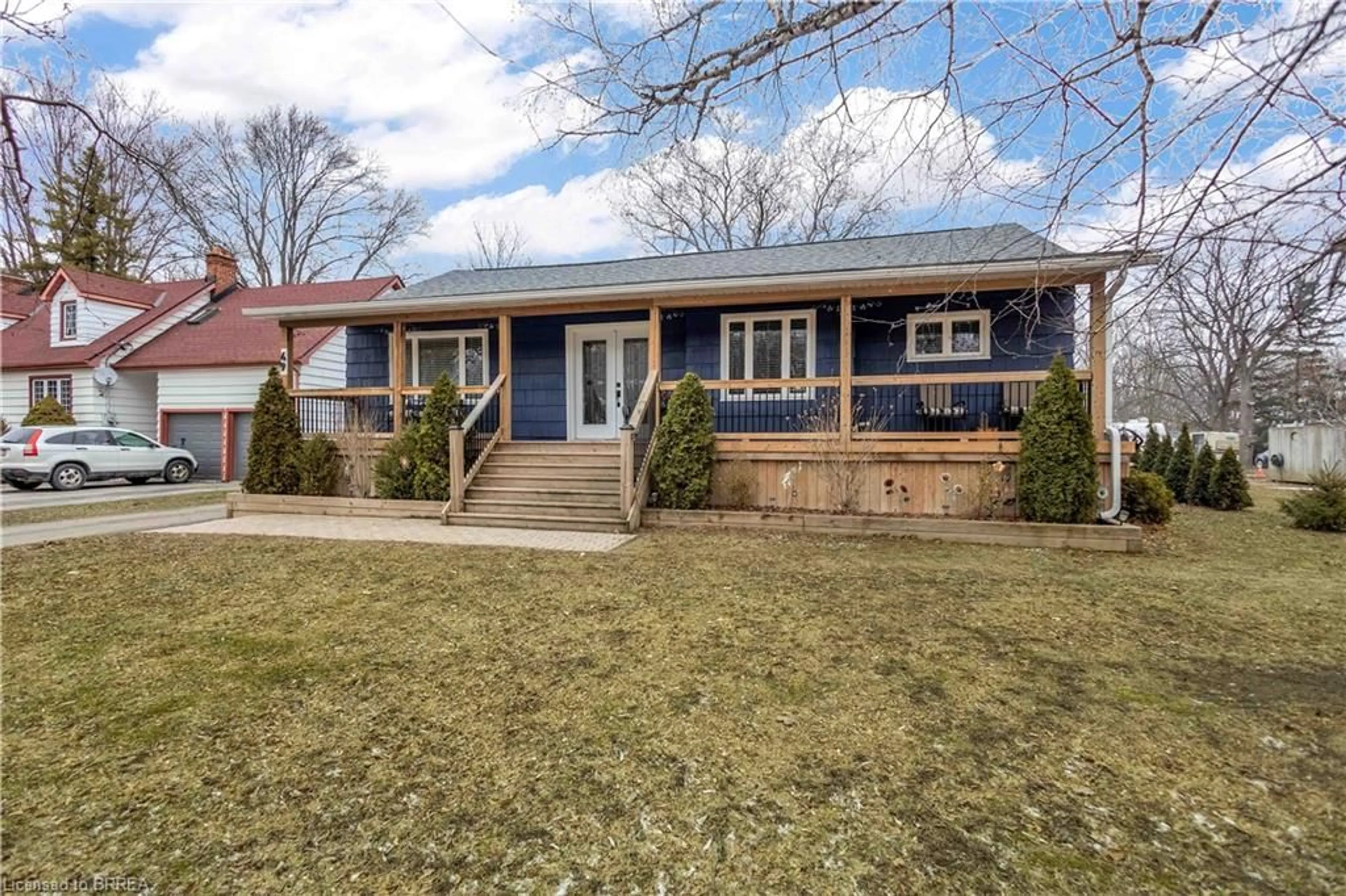 Home with vinyl exterior material, street for 49 Locks Rd, Brantford Ontario N3S 6Z1