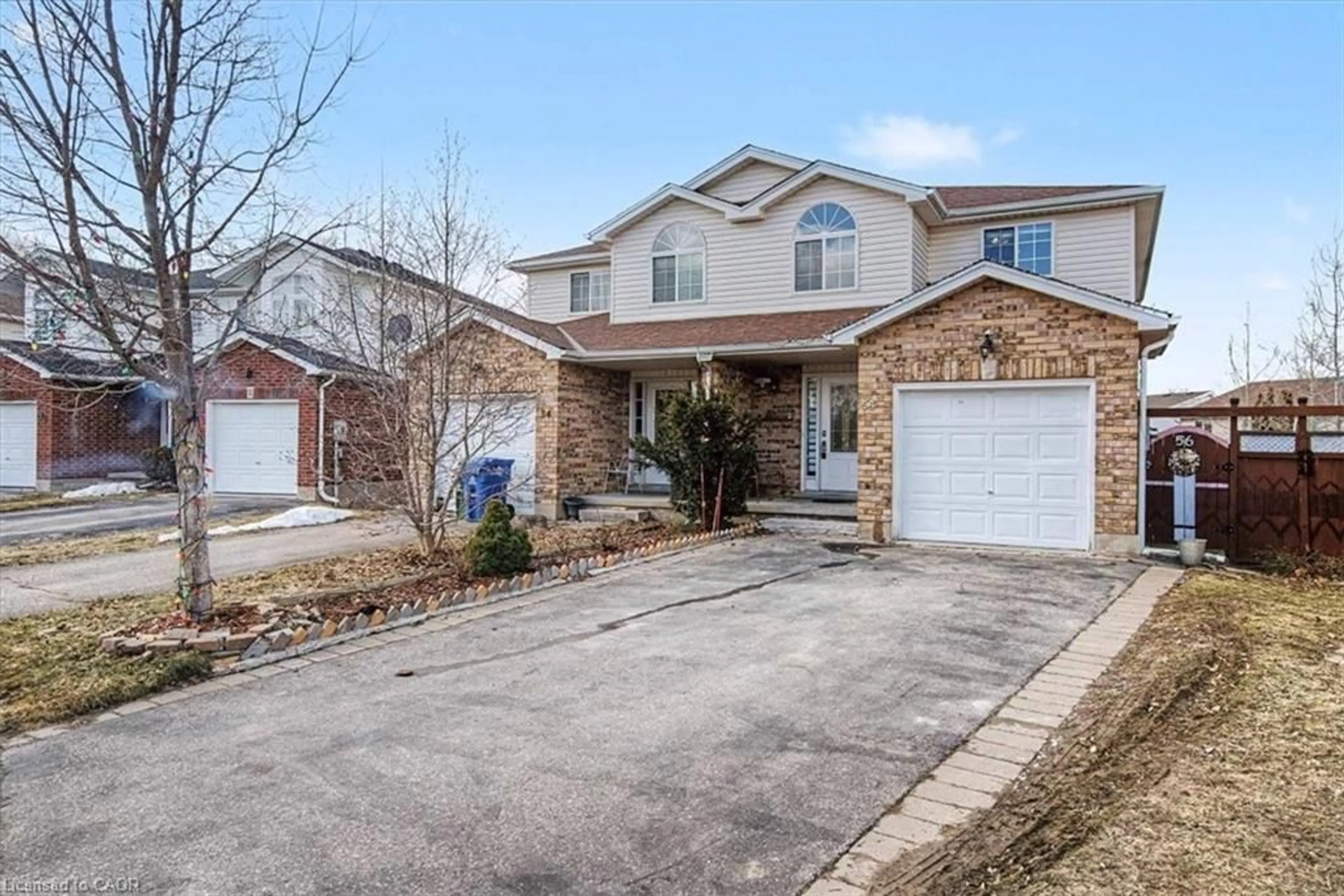 Home with brick exterior material, street for 56 Raspberry Lane, Guelph Ontario N1E 7H5