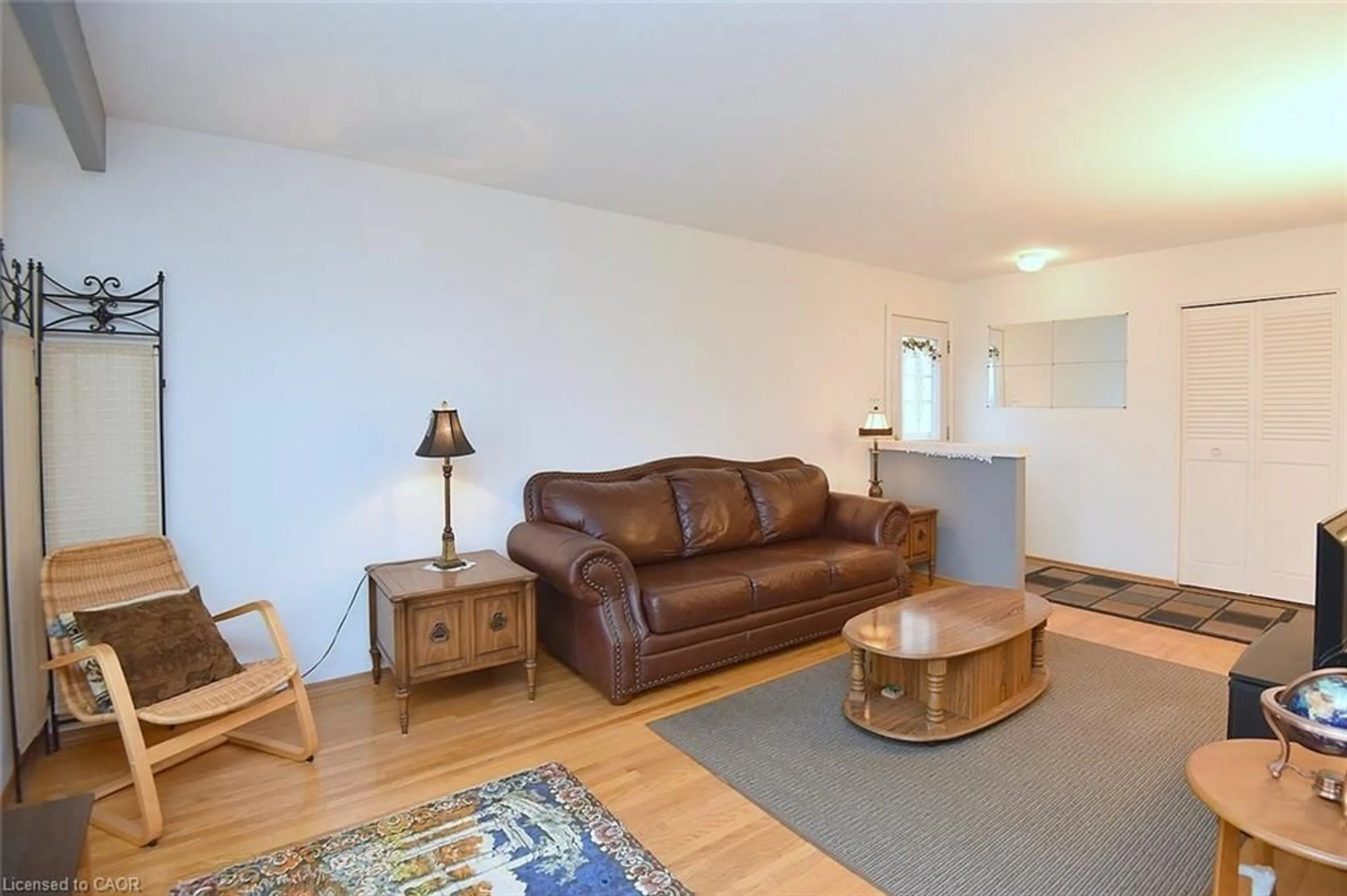 Living room with furniture, wood/laminate floor for 8 Bala Pl, Hamilton Ontario L9C 4Y5