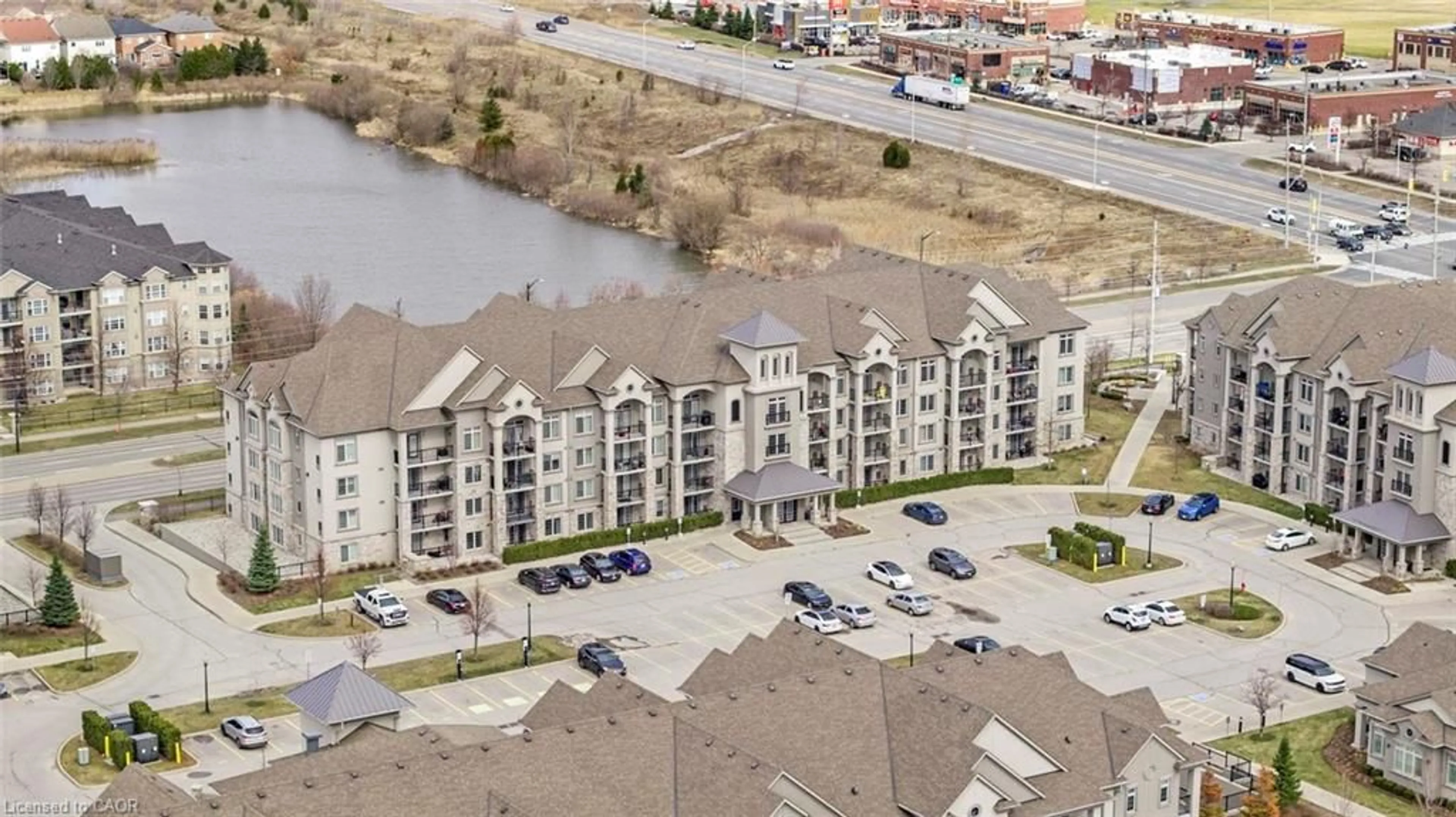 A pic from outside/outdoor area/front of a property/back of a property/a pic from drone, water/lake/river/ocean view for 1460 Main St #104, Milton Ontario L9T 8W5