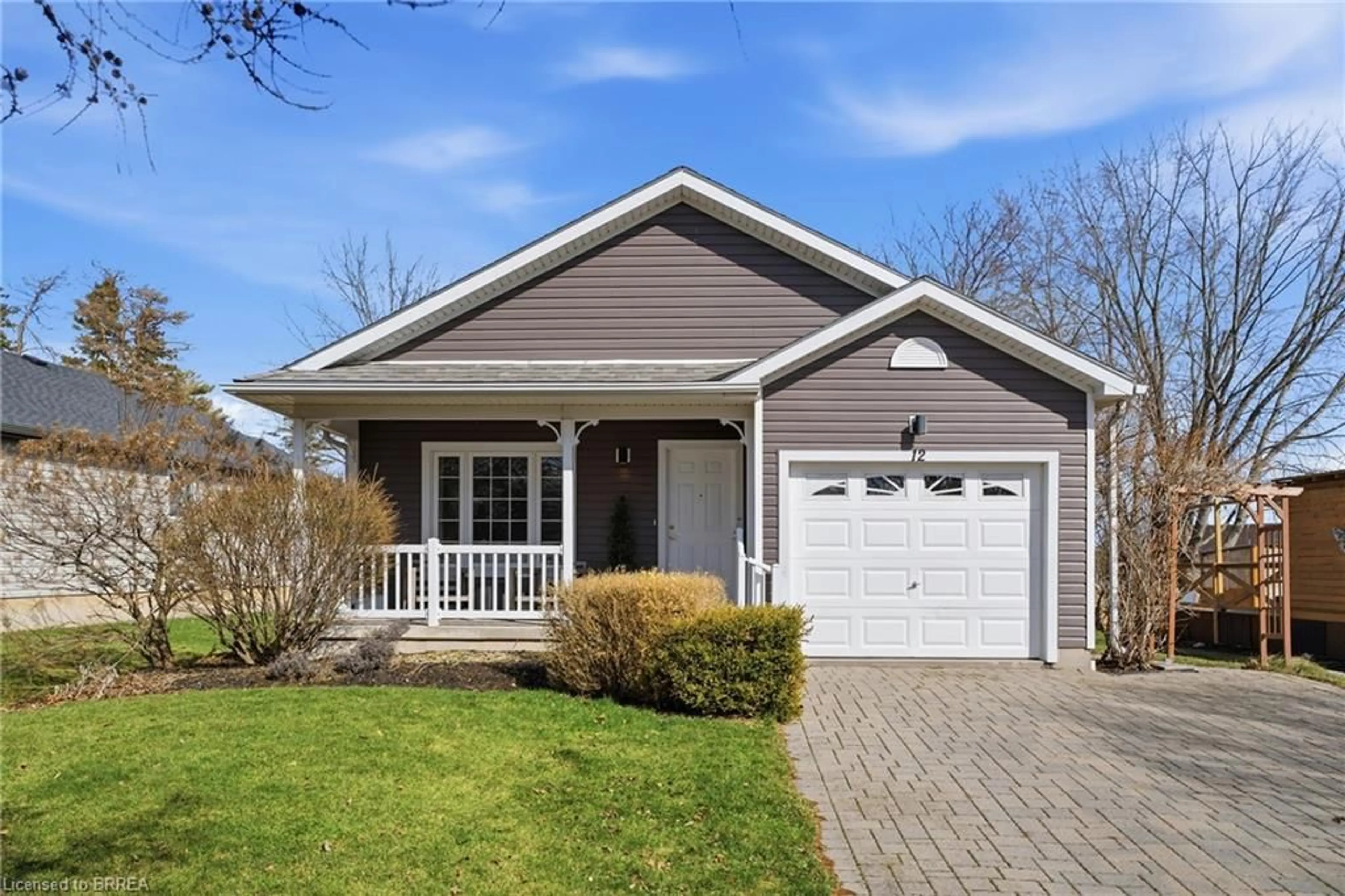 Home with vinyl exterior material, street for 12 Denby Rd, Port Dover Ontario N0A 1N4