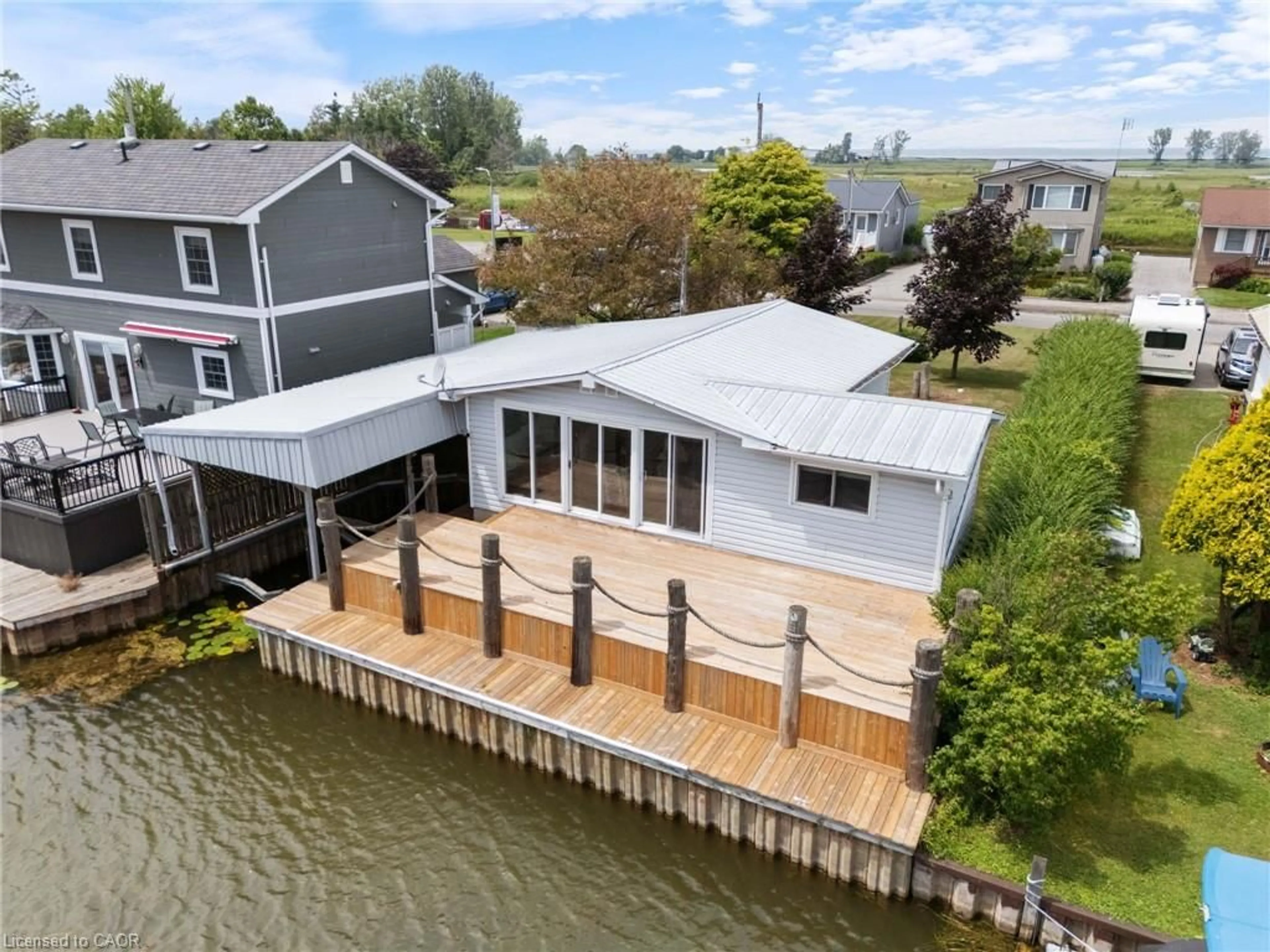 A pic from outside/outdoor area/front of a property/back of a property/a pic from drone, water/lake/river/ocean view for 23 Rogers Ave, Long Point Ontario N0E 1M0