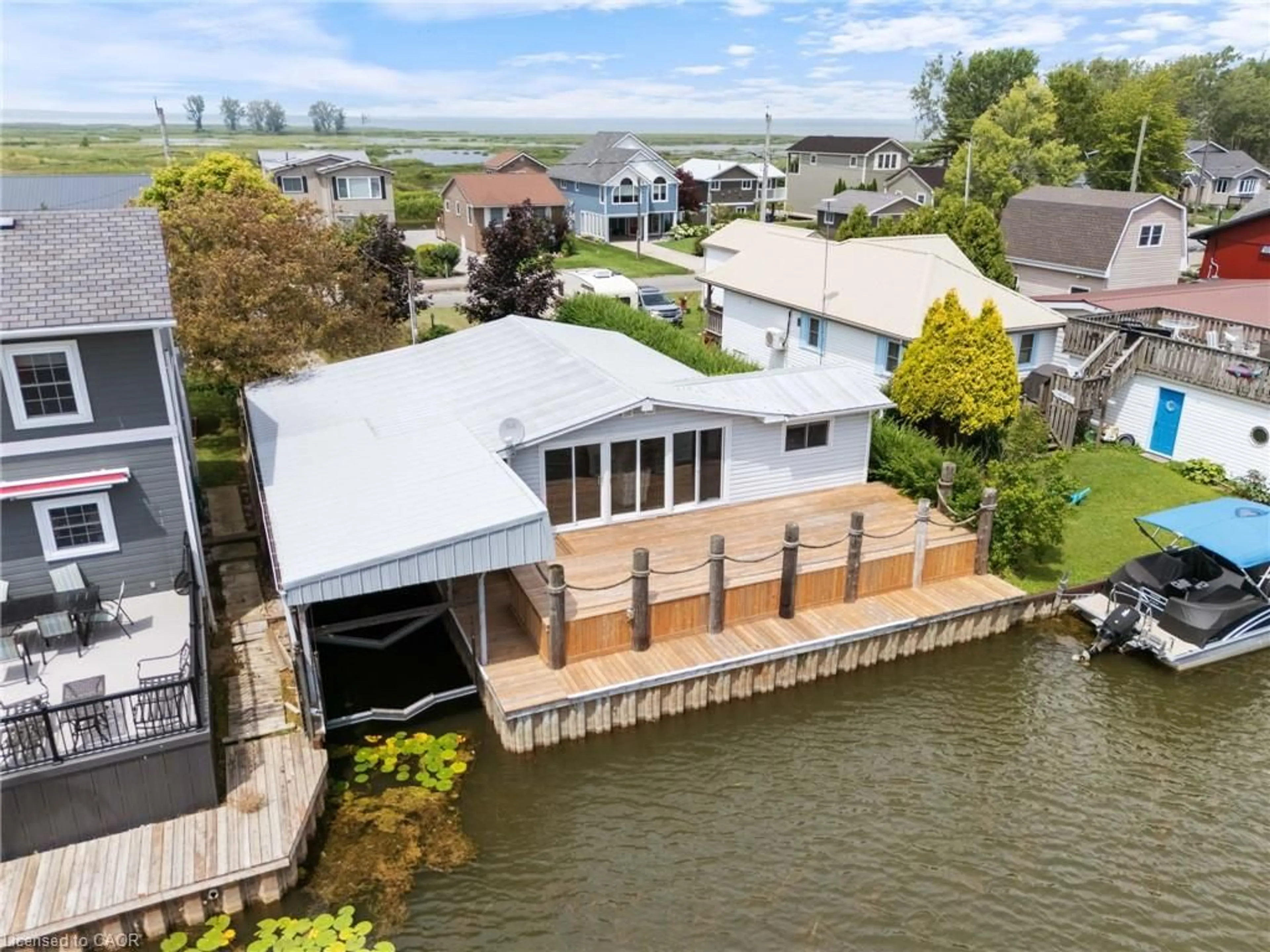 A pic from outside/outdoor area/front of a property/back of a property/a pic from drone, water/lake/river/ocean view for 23 Rogers Ave, Long Point Ontario N0E 1M0