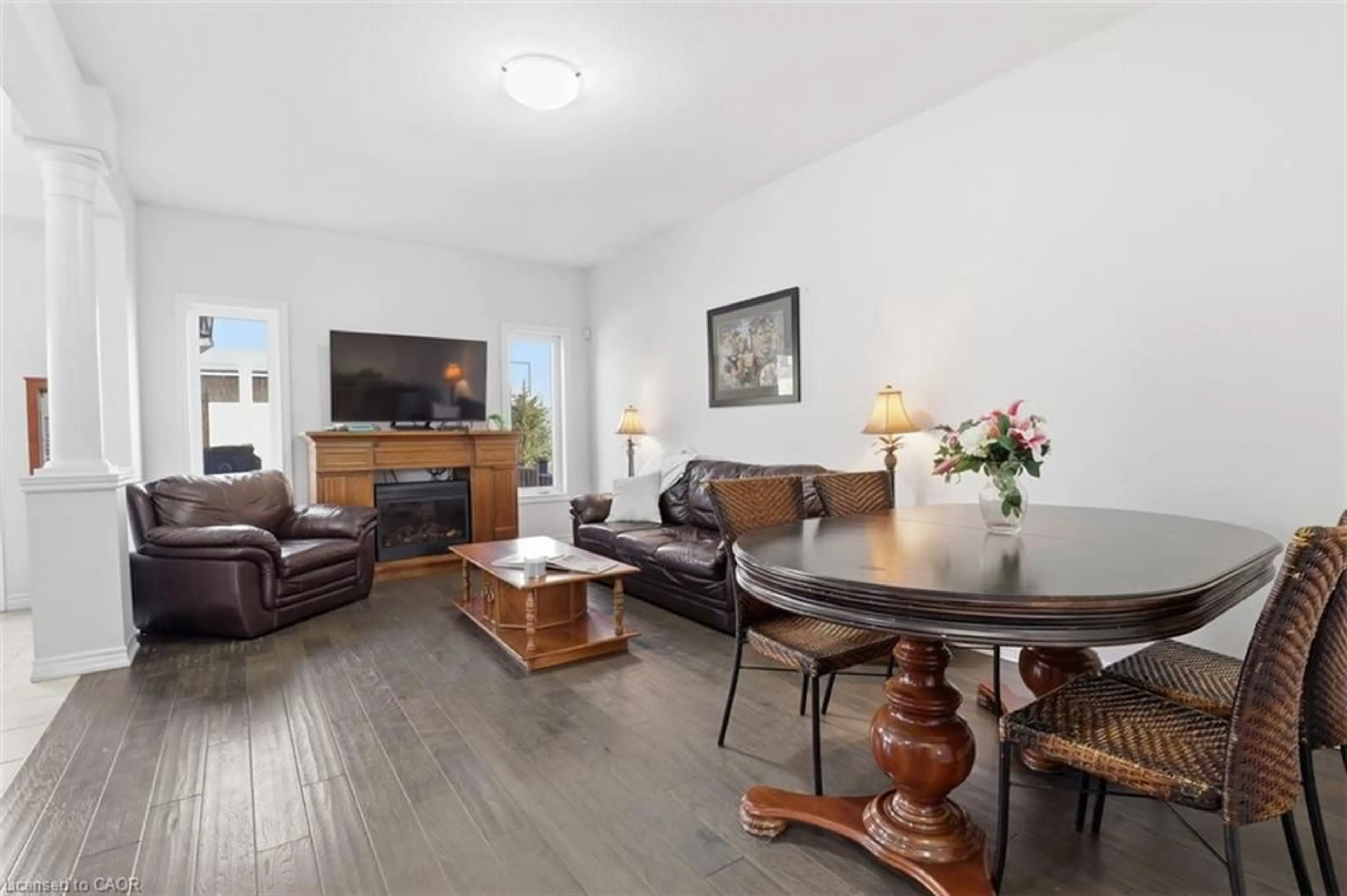 Living room with furniture, wood/laminate floor for 18 Vic Chambers Pl, Paris Ontario N3L 0E6