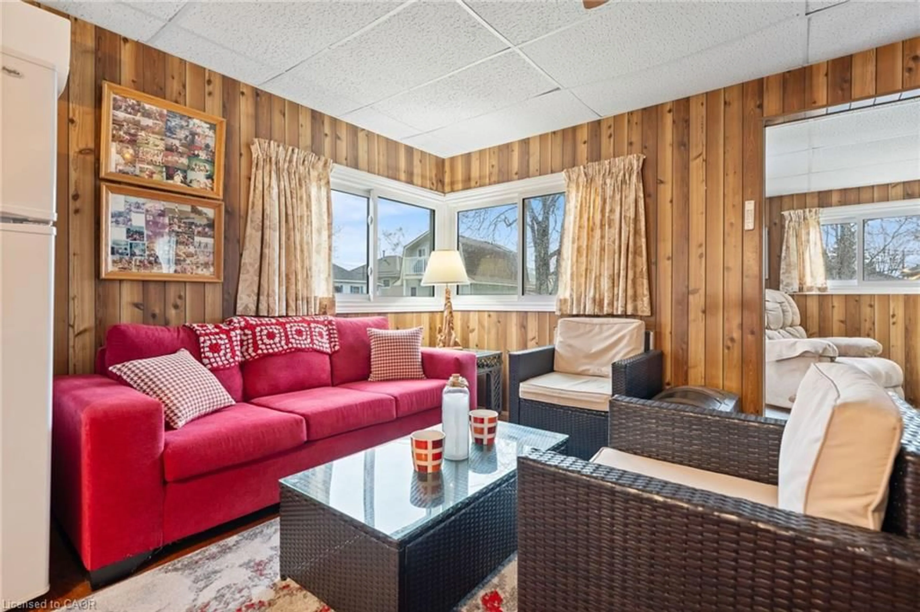 Living room with furniture, wood/laminate floor for 3 Harold St, Turkey Point Ontario N0E 1T0