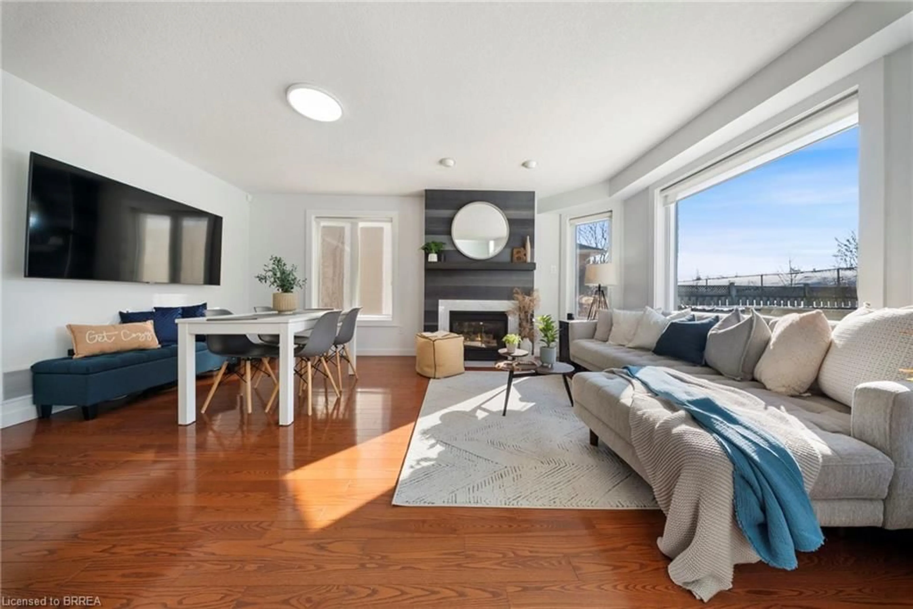 Living room with furniture, wood/laminate floor for 67 Wadsworth Cres, Cambridge Ontario N1S 5A3