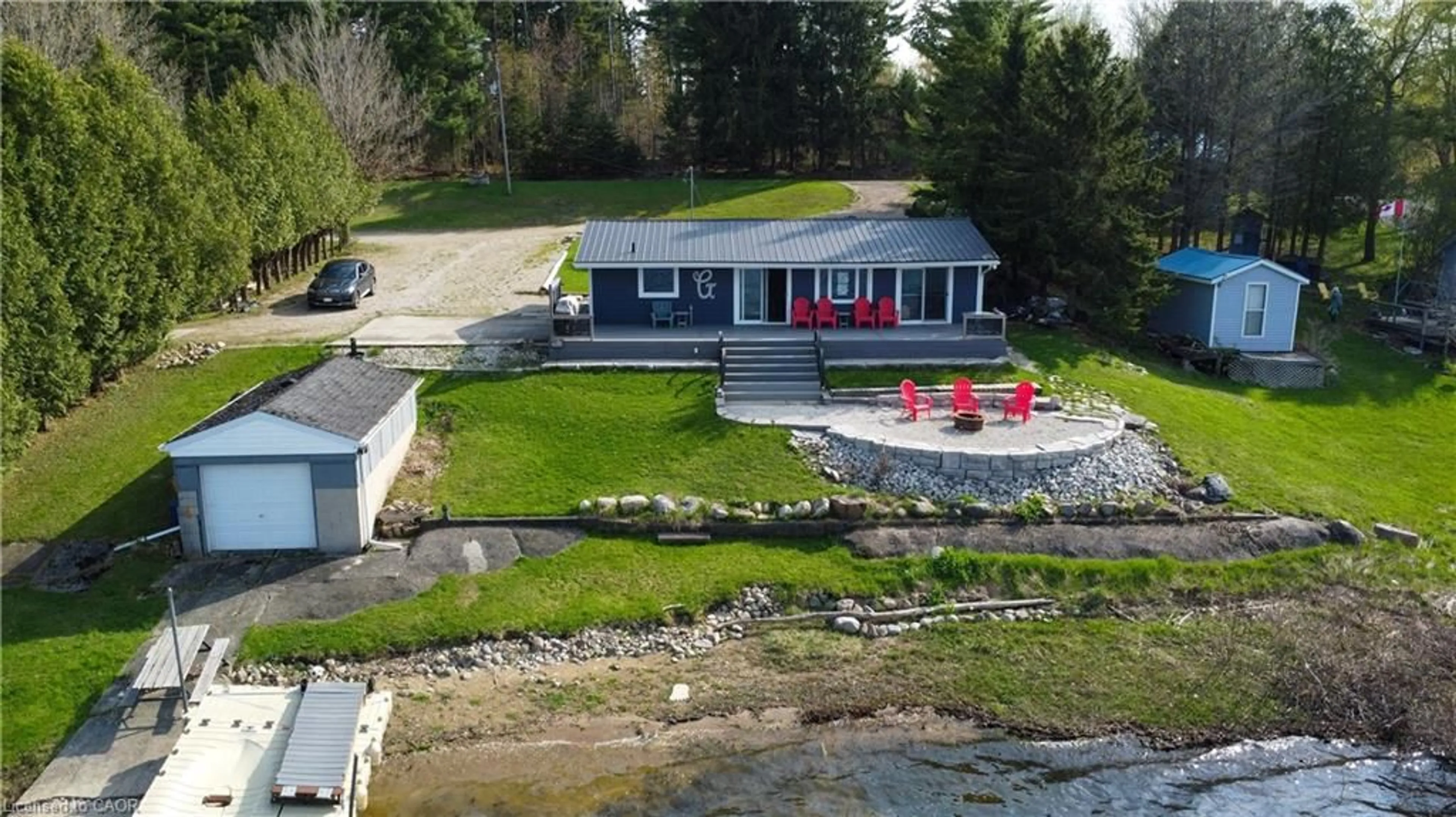 A pic from outside/outdoor area/front of a property/back of a property/a pic from drone, water/lake/river/ocean view for 137 Road 100, Conestogo Lake Ontario N0G 1P0