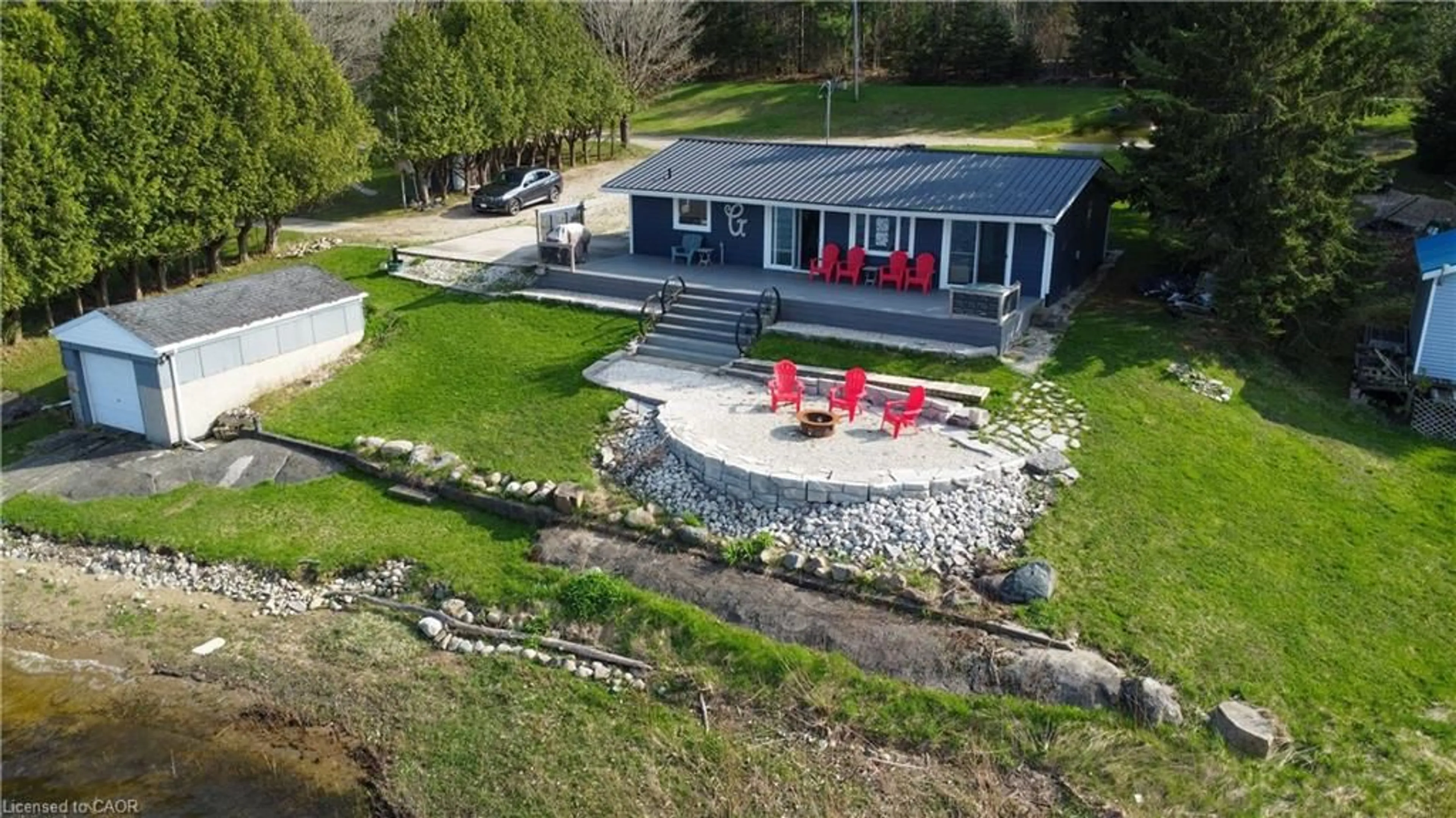A pic from outside/outdoor area/front of a property/back of a property/a pic from drone, water/lake/river/ocean view for 137 Road 100, Conestogo Lake Ontario N0G 1P0