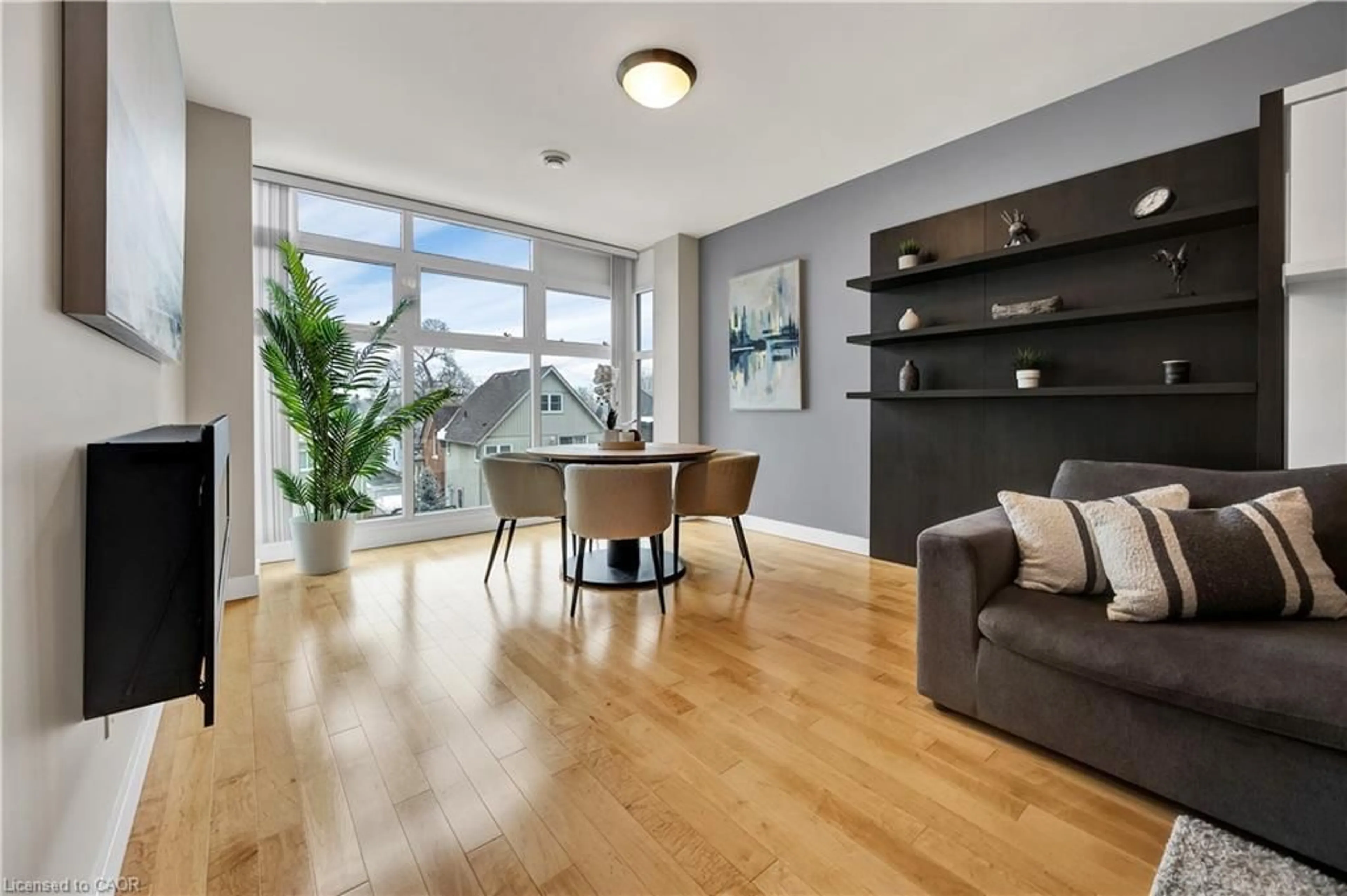 Living room with furniture, wood/laminate floor for 188 King St #310, Waterloo Ontario N2J 0C6