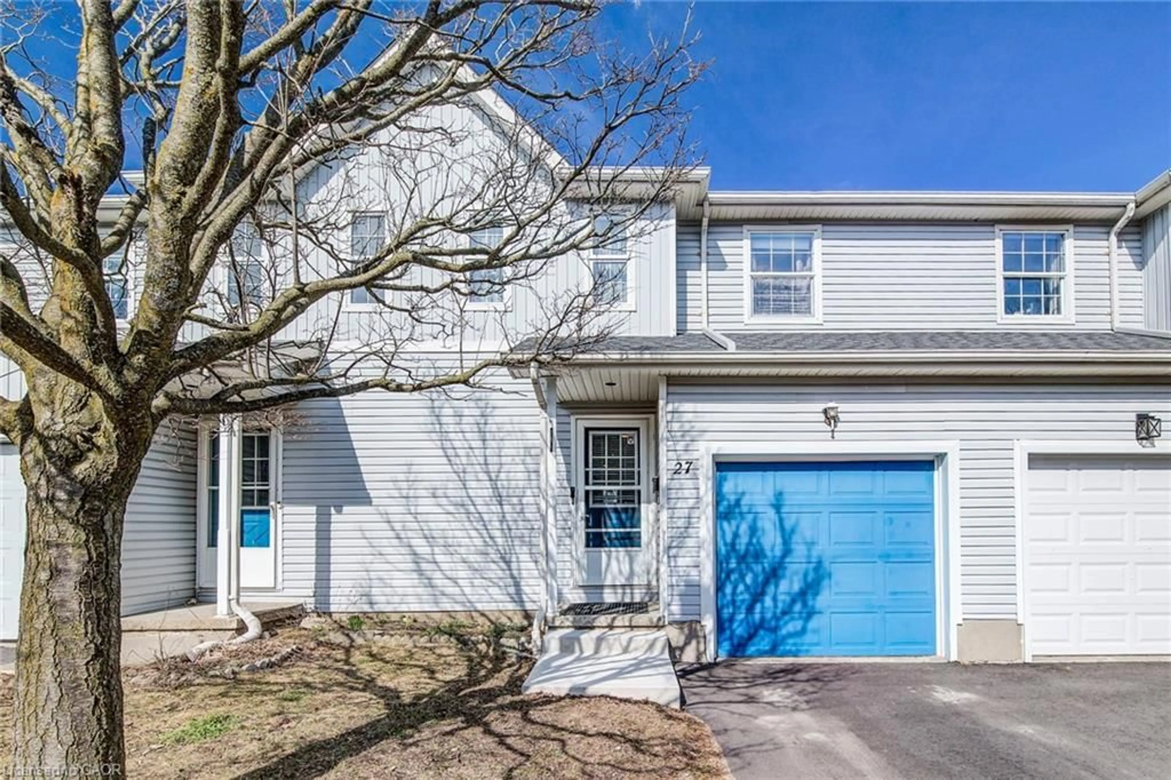 Home with vinyl exterior material, street for 90 Mooregate Cres #27, Kitchener Ontario N2M 5P7