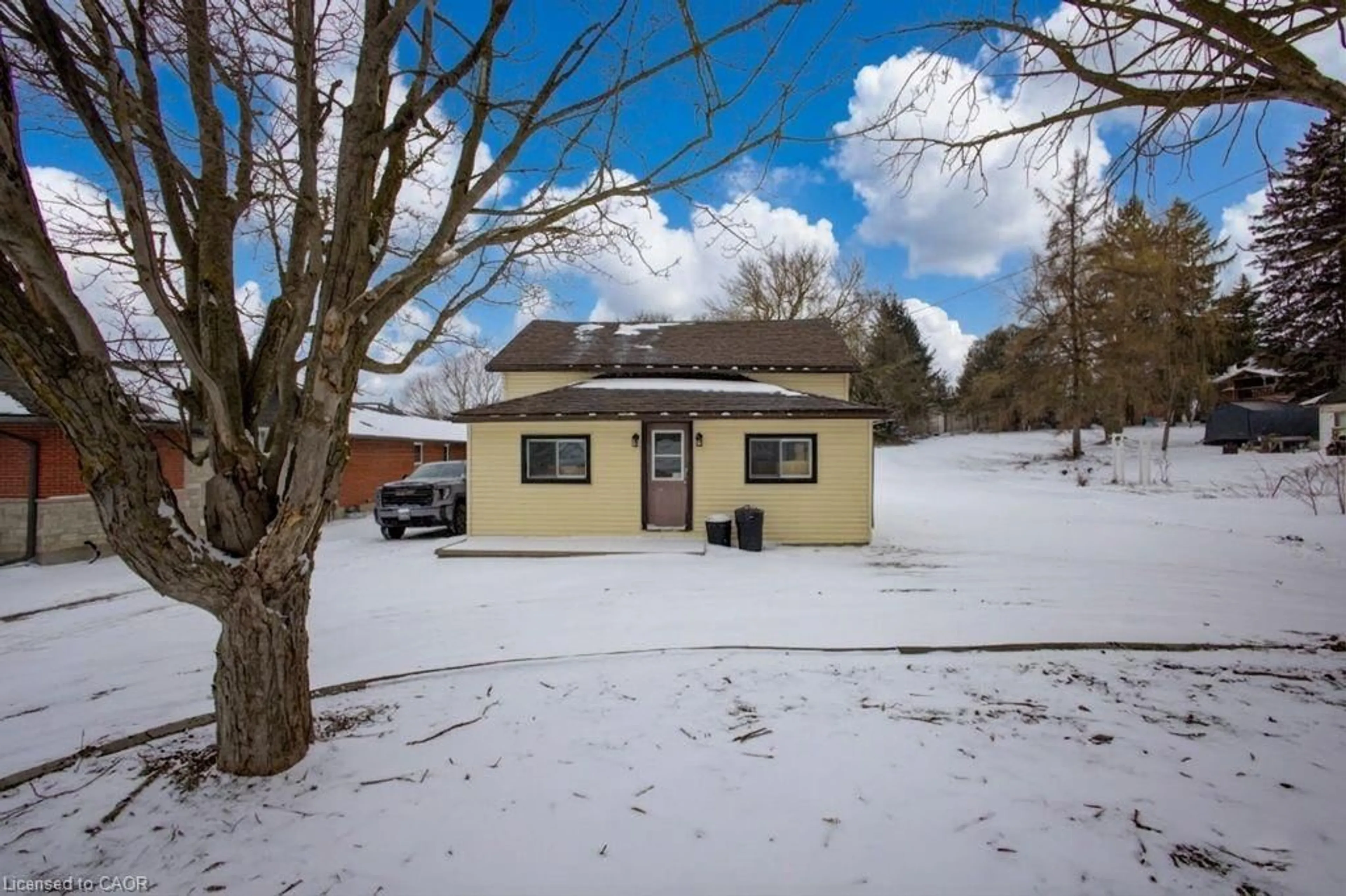 A pic from outside/outdoor area/front of a property/back of a property/a pic from drone, street for 21 Main St, Drayton Ontario N0G 1P0